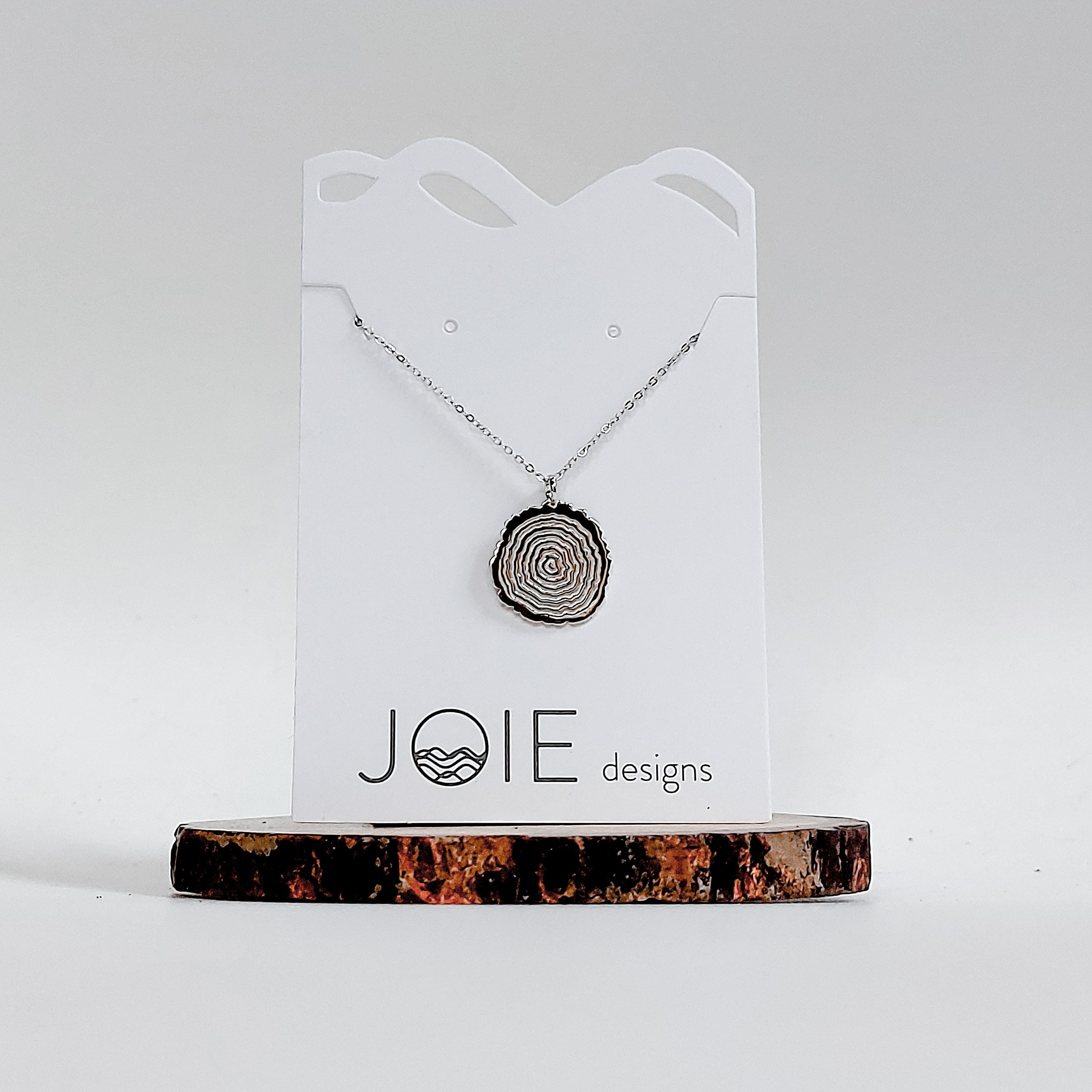 Matsuyo Tree Ring Necklace featuring a sterling silver pendant with detailed log rings, available in various chain lengths and plating options.