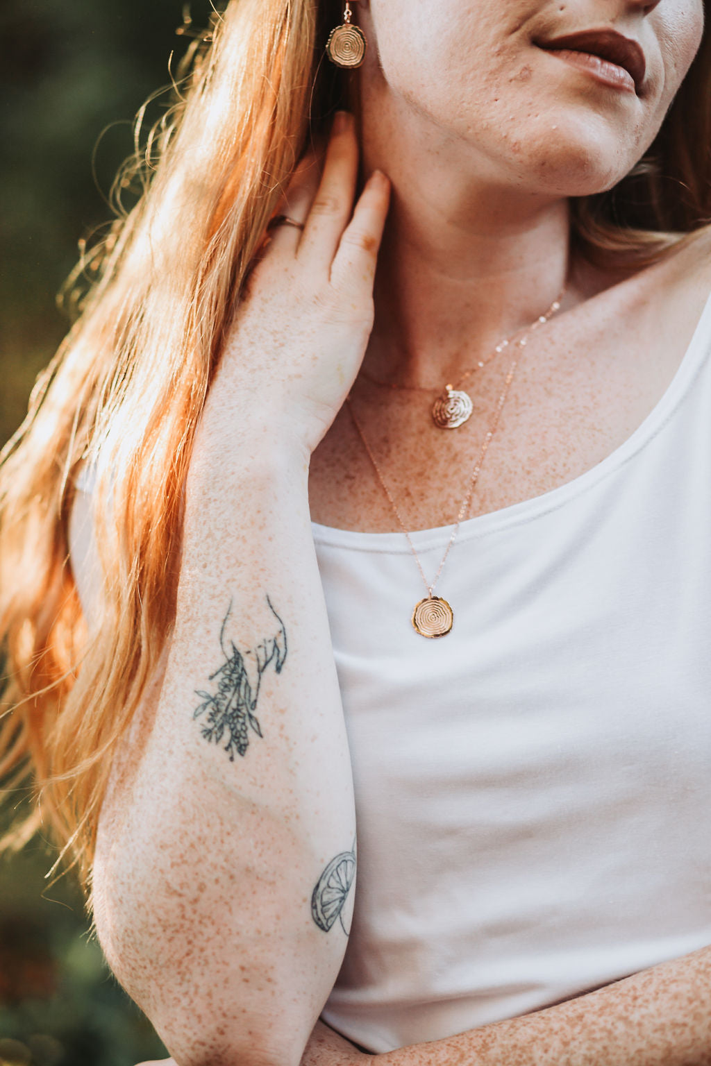 Matsuyo Tree Ring Necklace featuring a sterling silver pendant with detailed log rings, available in various chain lengths and plating options.