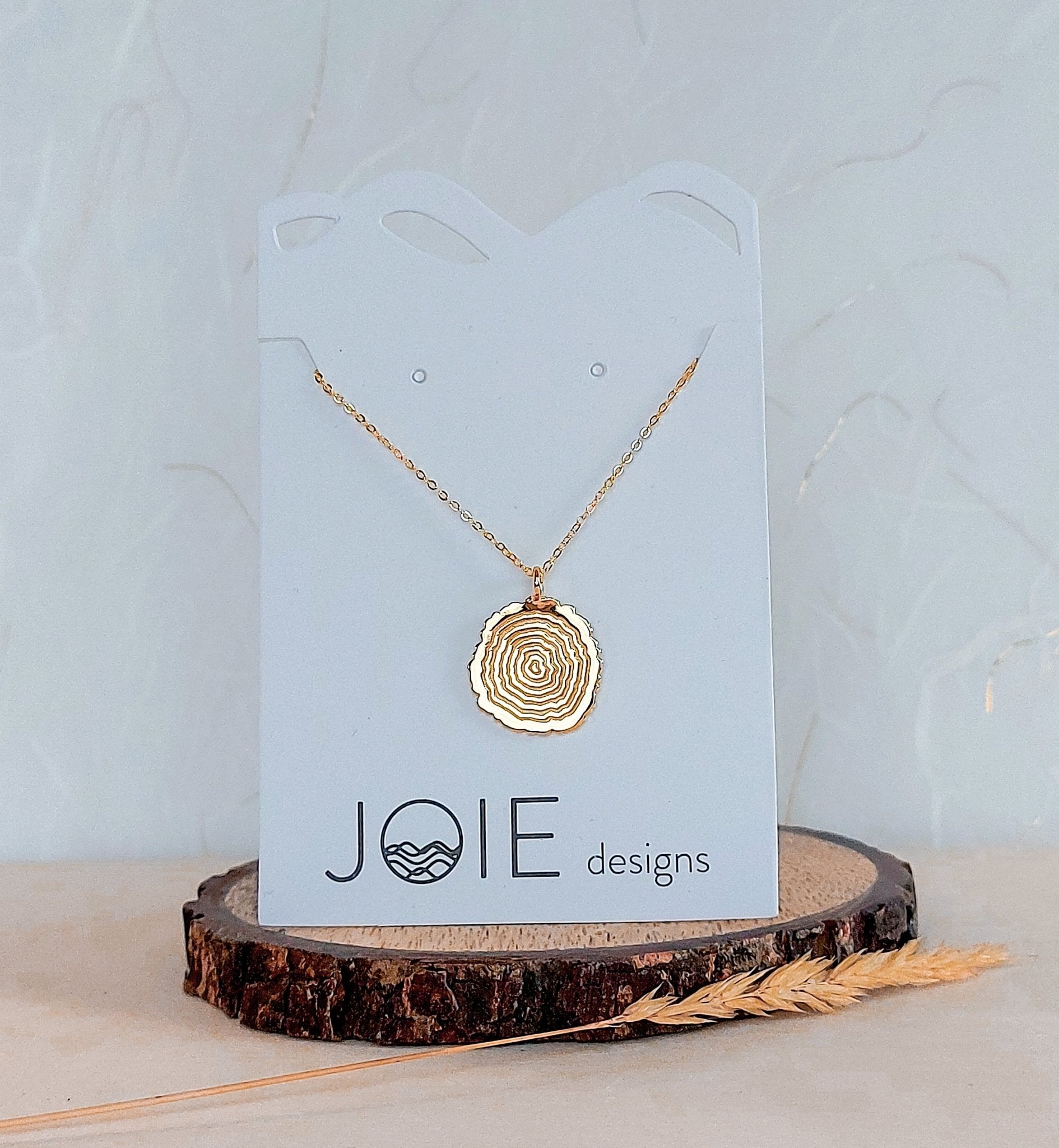 Matsuyo Tree Ring Necklace featuring a sterling silver pendant with detailed log rings, available in various chain lengths and plating options.