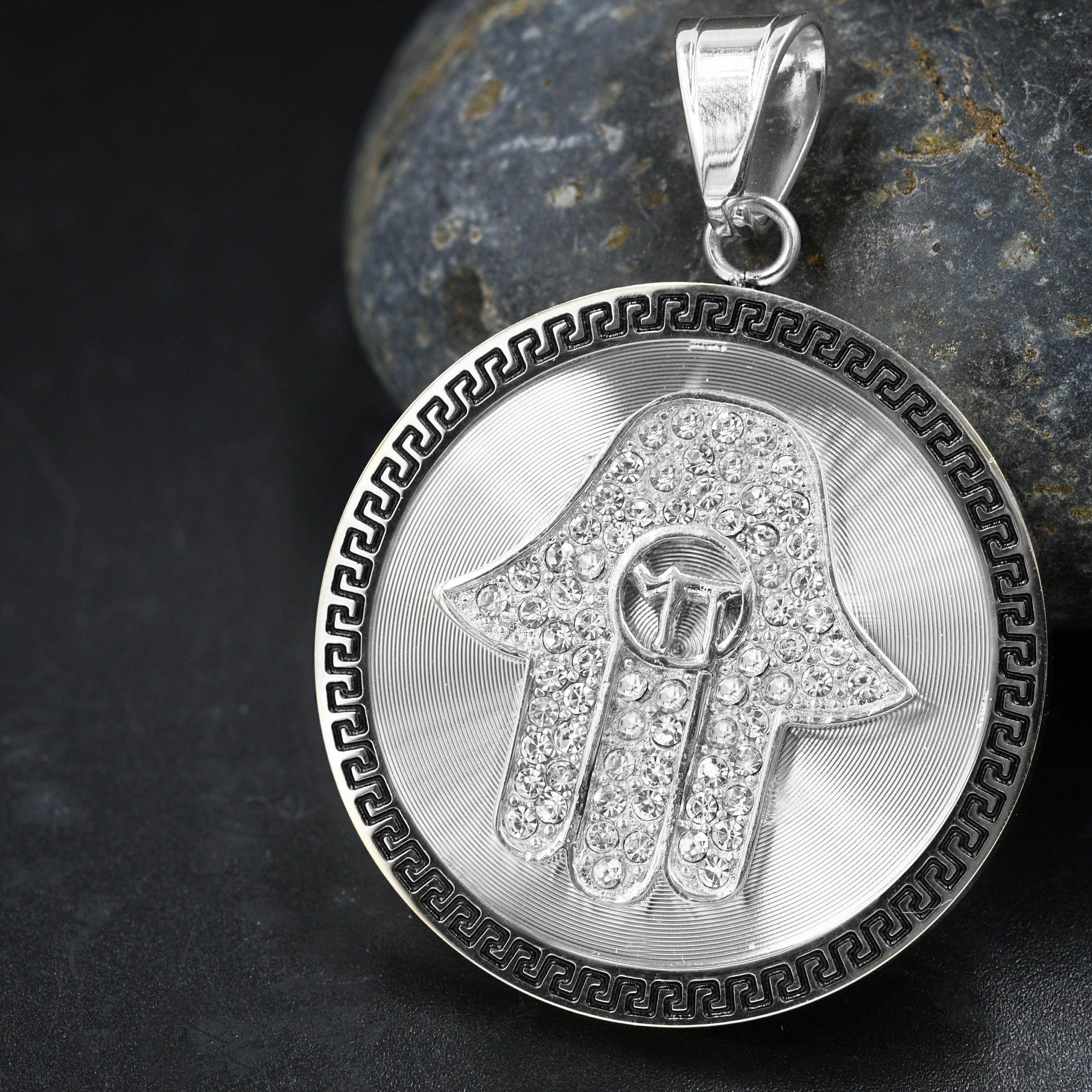 MAURO Steel Pendant featuring a cubic zirconia stone, symbolizing good luck and protection, designed for trendy street-wear.