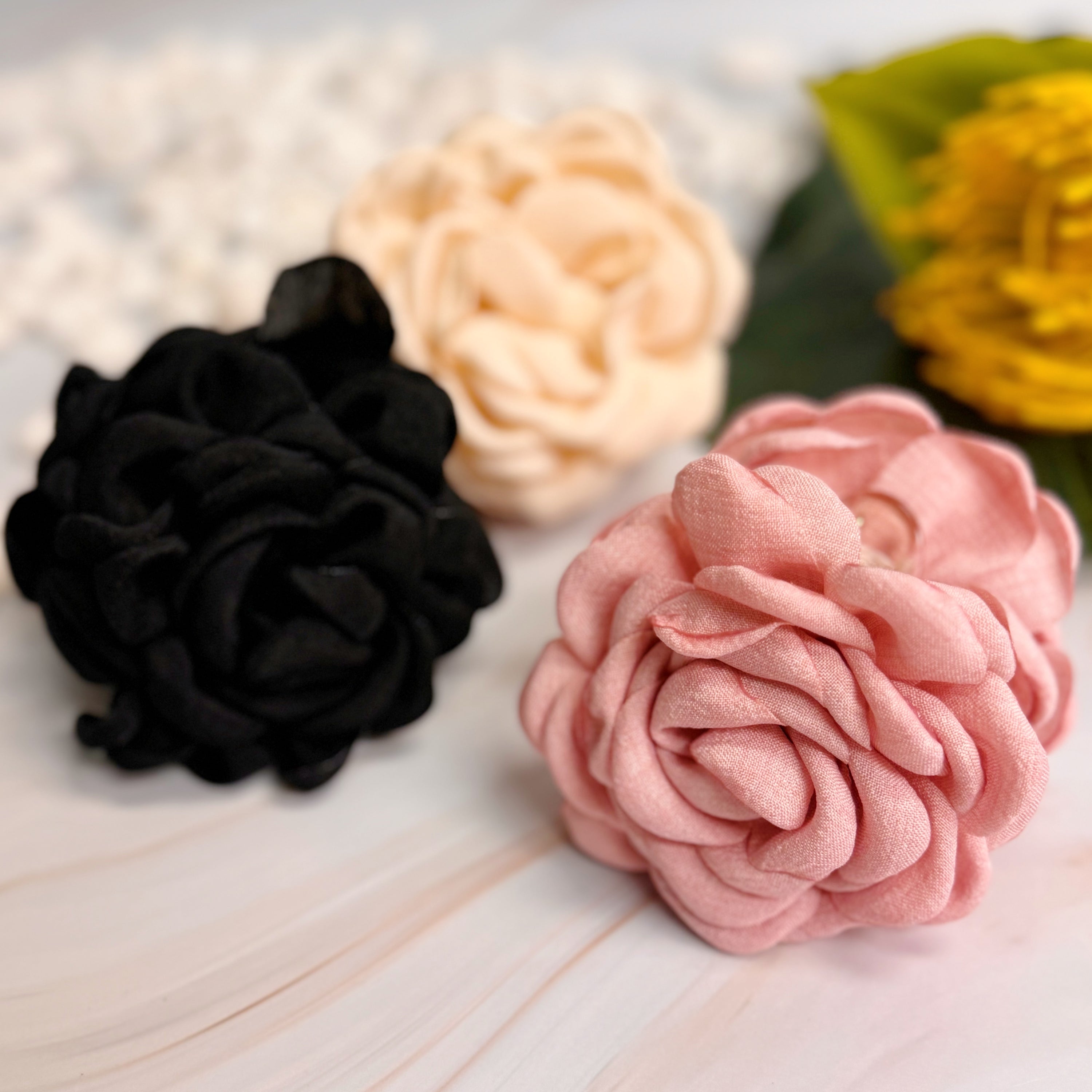 May Rose Double Sided Hair Claw featuring delicate fabric petals and floral design, perfect for elegant hairstyles.