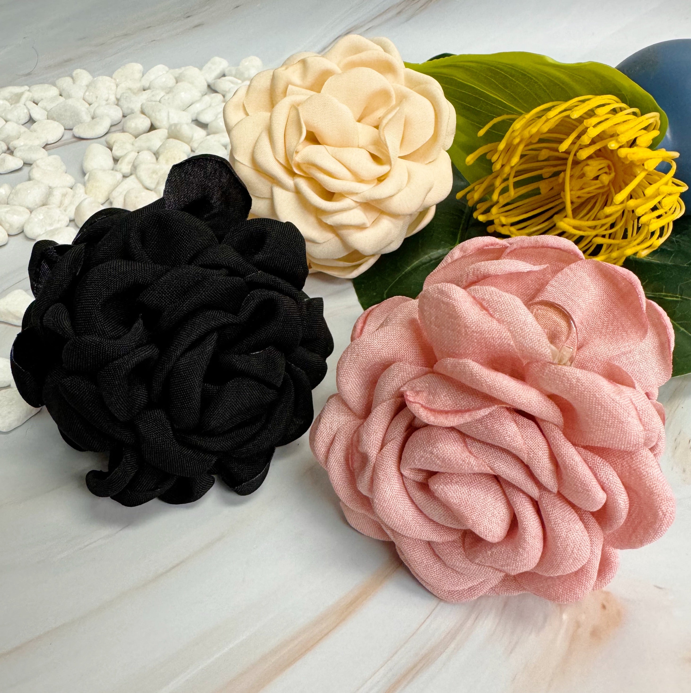 May Rose Double Sided Hair Claw featuring delicate fabric petals and floral design, perfect for elegant hairstyles.