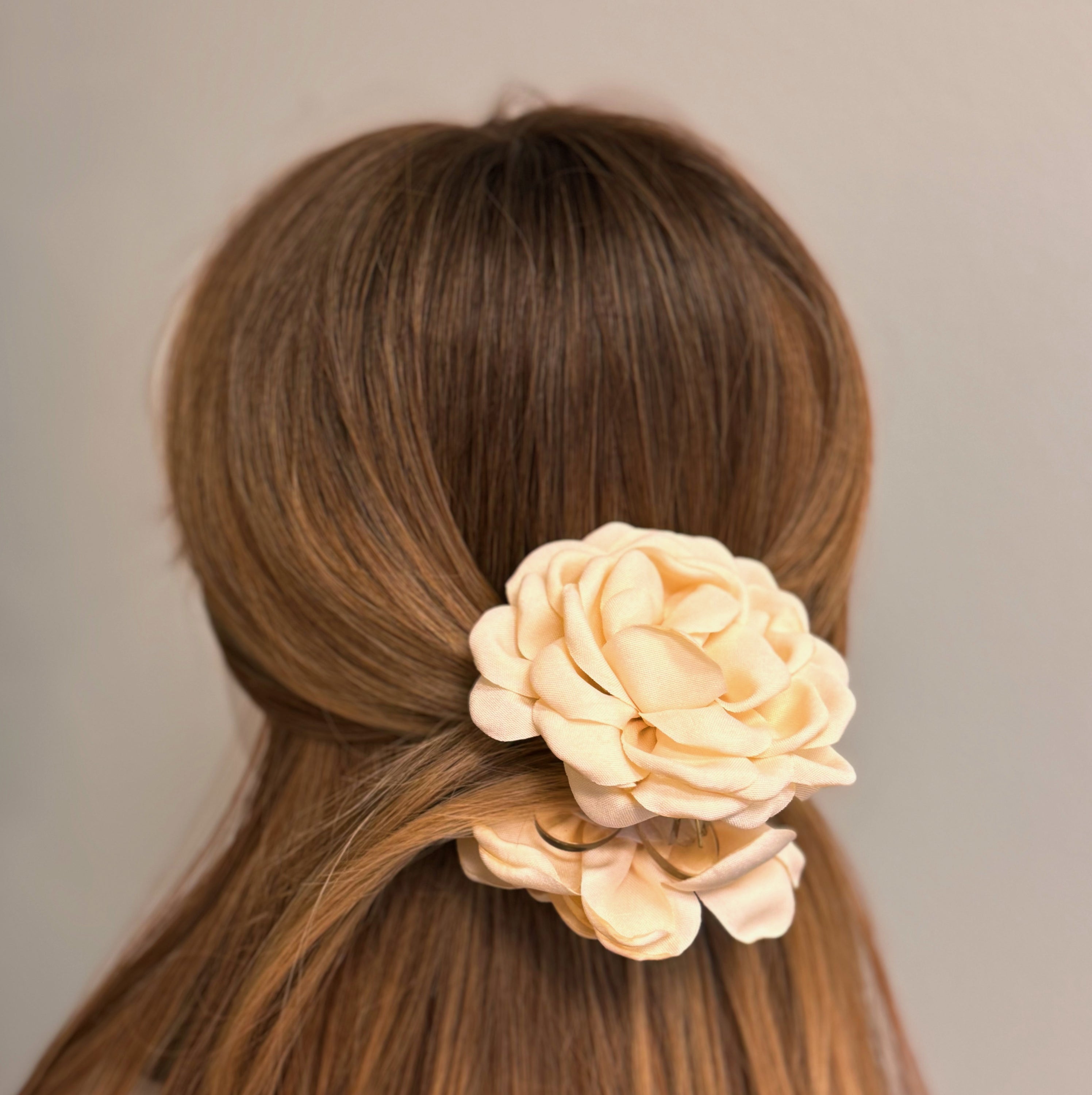 May Rose Double Sided Hair Claw featuring delicate fabric petals and floral design, perfect for elegant hairstyles.