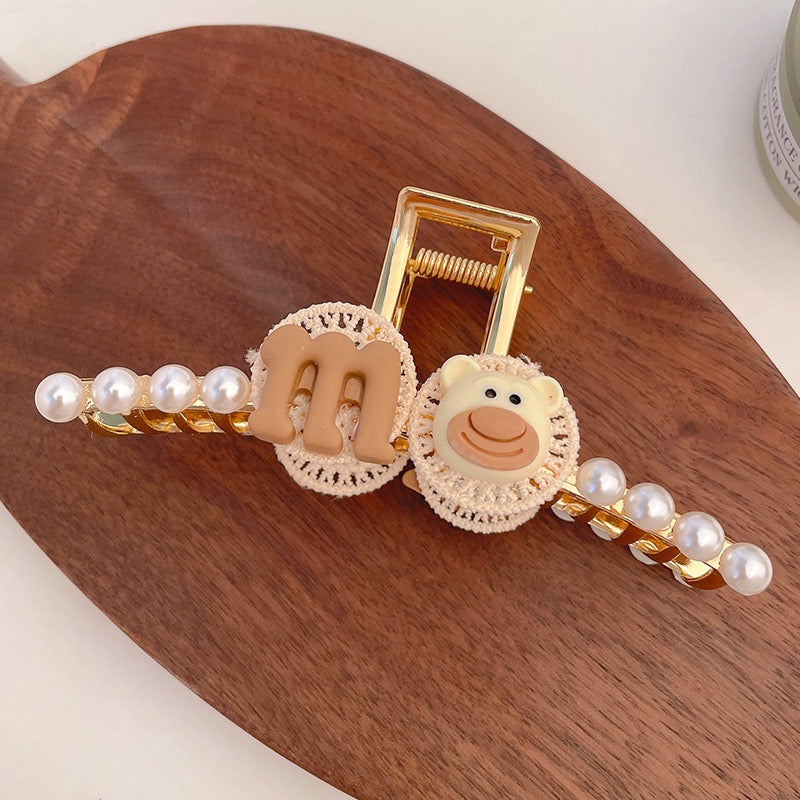 M-Bear with Pearls Hair Clasp featuring a bear design and artificial pearls, perfect for stylish hairdos.