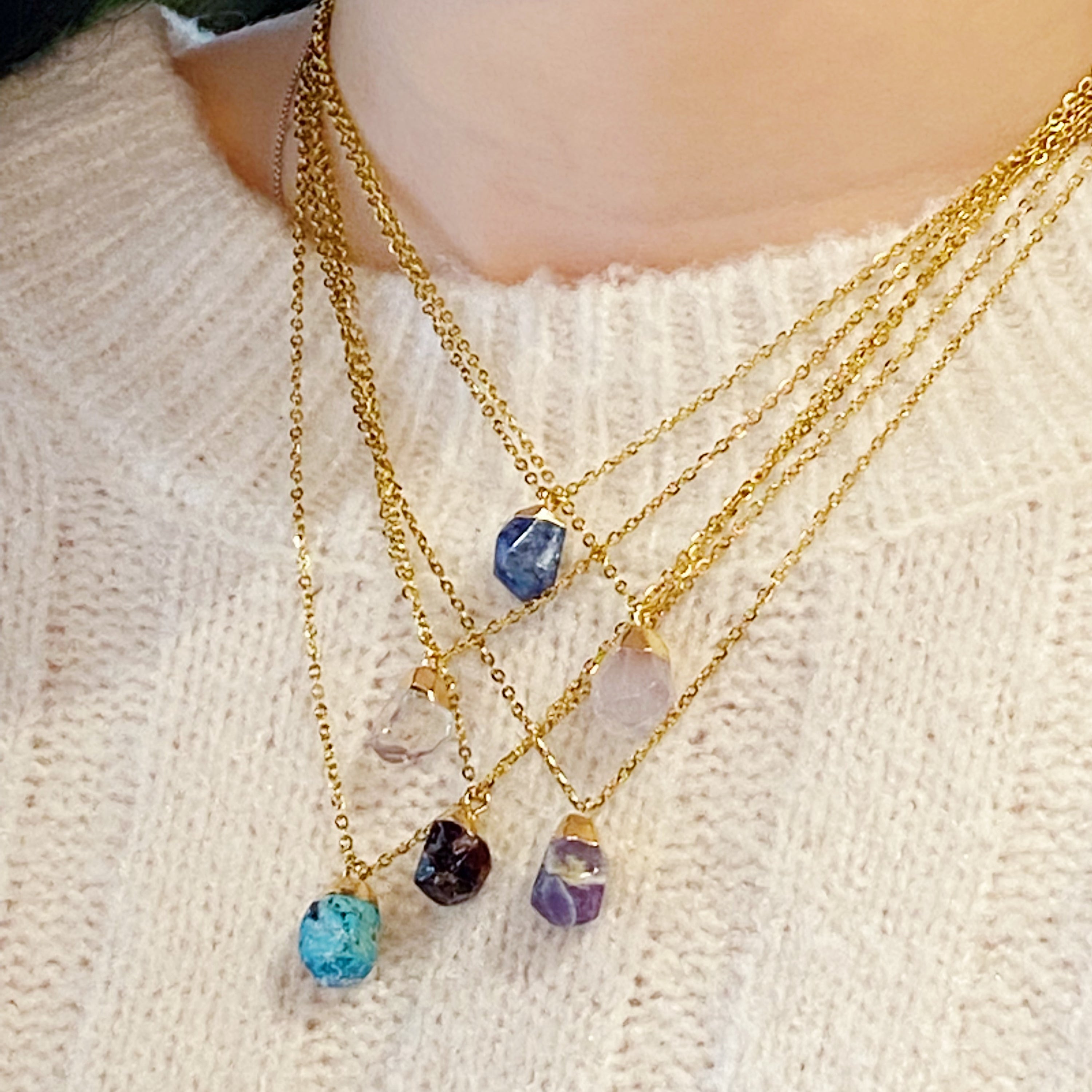 A beautiful Meditation Semi-Precious Stone Pendant Necklace featuring a natural stone pendant on a gold-plated stainless steel chain.