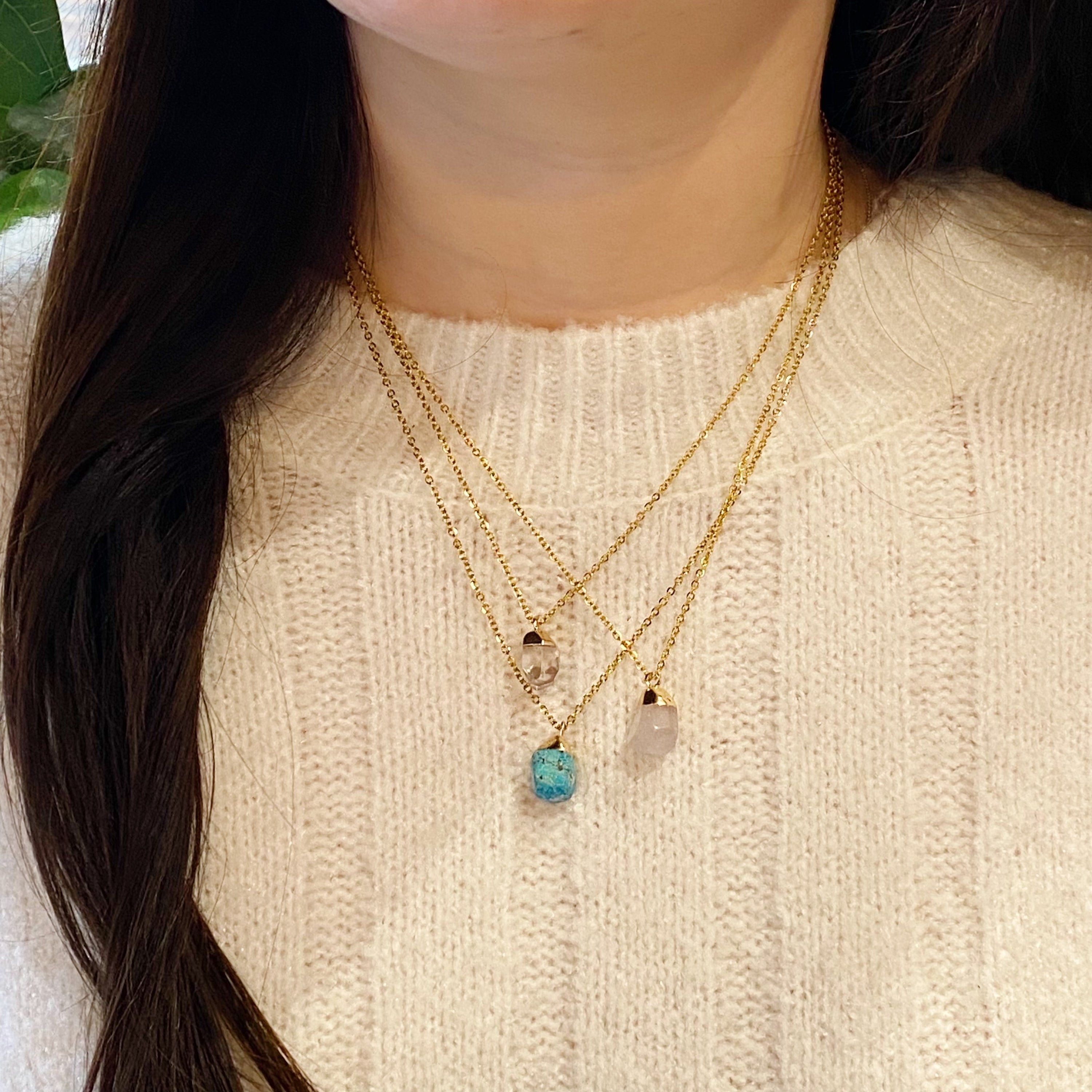 A beautiful Meditation Semi-Precious Stone Pendant Necklace featuring a natural stone pendant on a gold-plated stainless steel chain.