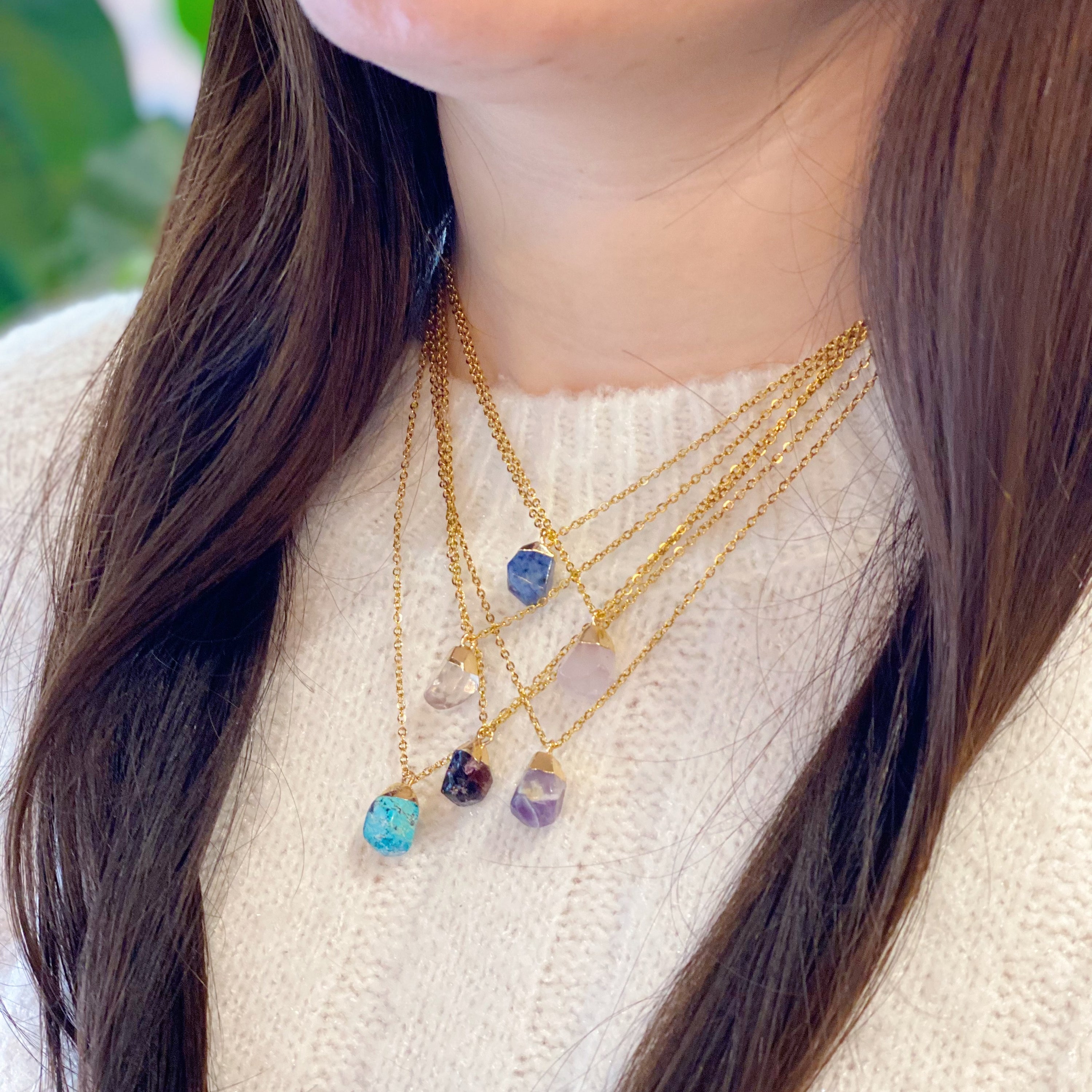 A beautiful Meditation Semi-Precious Stone Pendant Necklace featuring a natural stone pendant on a gold-plated stainless steel chain.