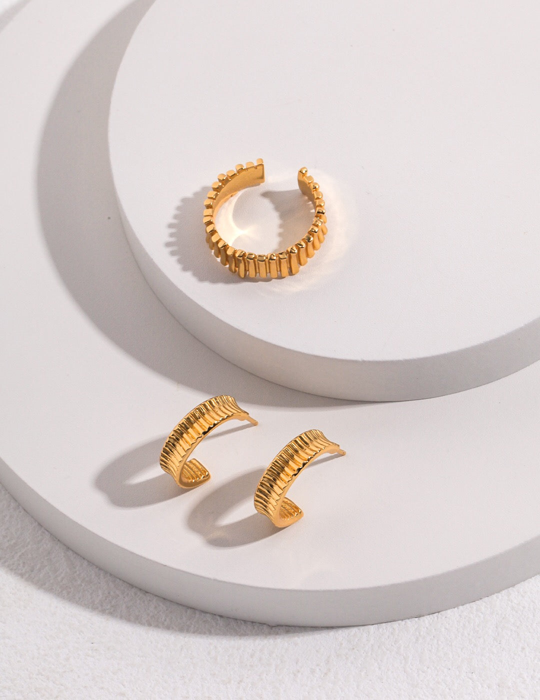 A pair of Medium Chunky Frill Hoop Earrings made from sterling silver and gold vermeil, showcasing a unique frill design.