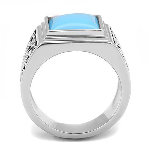 Men's stainless steel ring featuring synthetic turquoise in a vibrant sea blue color, showcasing a polished finish.