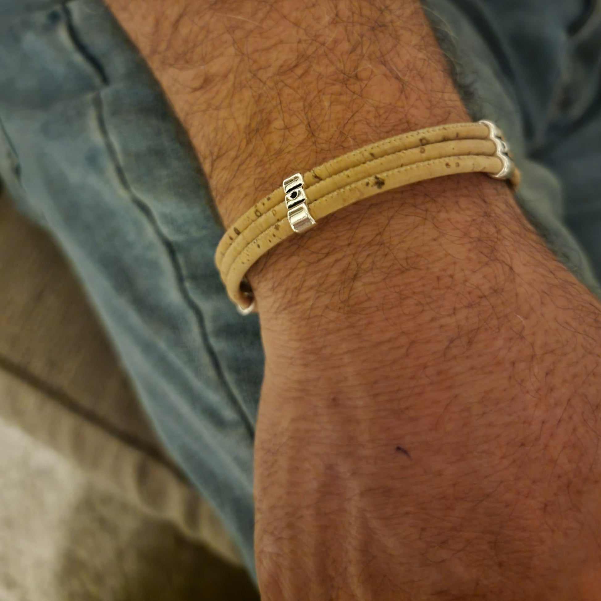 Men's Cork Bracelet - Triple featuring three strands of natural cork and a hammered magnetic clasp, showcasing its unique design.