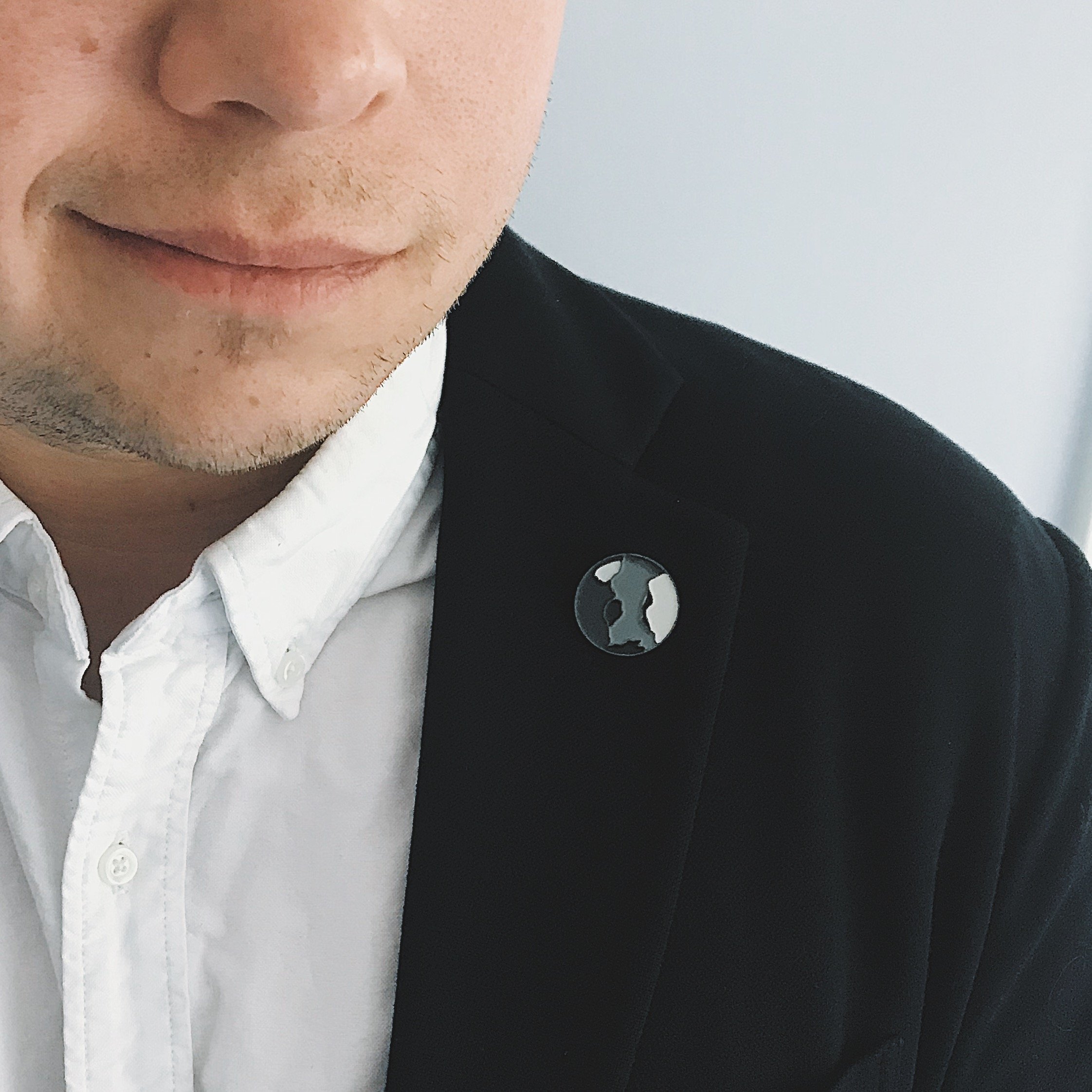 Mercury Enamel Pin featuring a gray planet design by Lauren Beacham, perfect for jackets and backpacks.