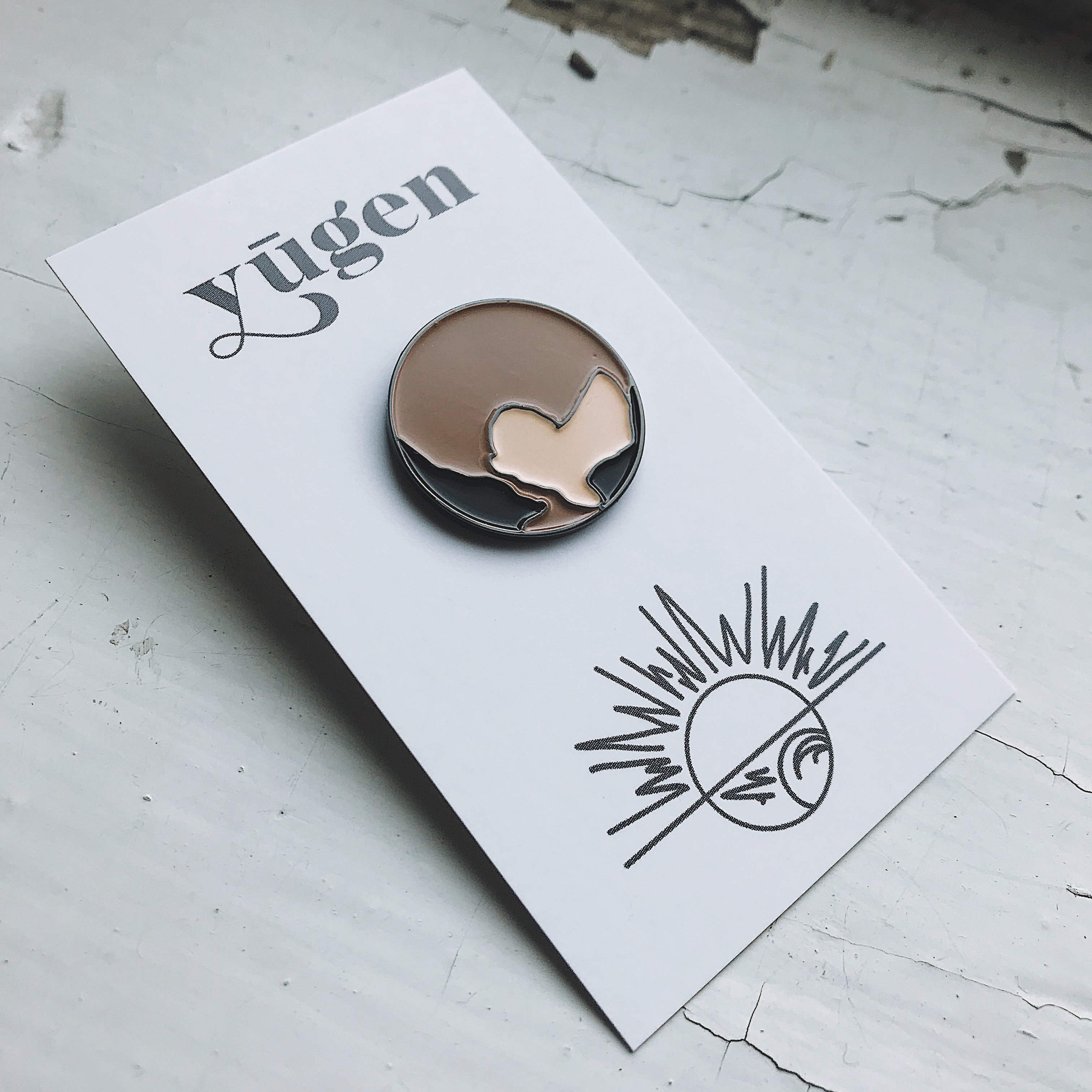 Mercury Enamel Pin featuring a gray planet design by Lauren Beacham, perfect for jackets and backpacks.