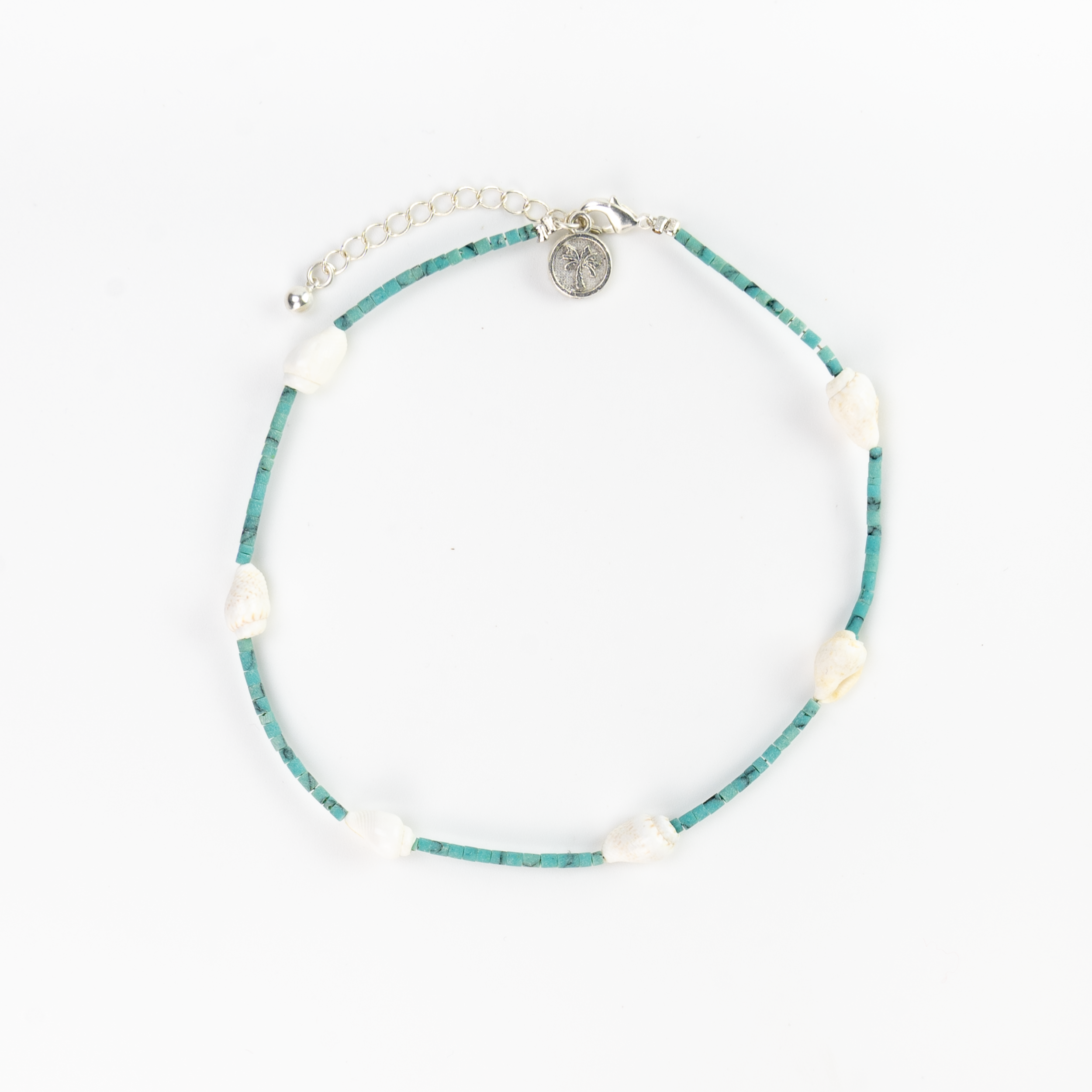 Meribella Shell Stone Anklet featuring turquoise beads and real shells, showcasing a minimalistic ocean-inspired design.