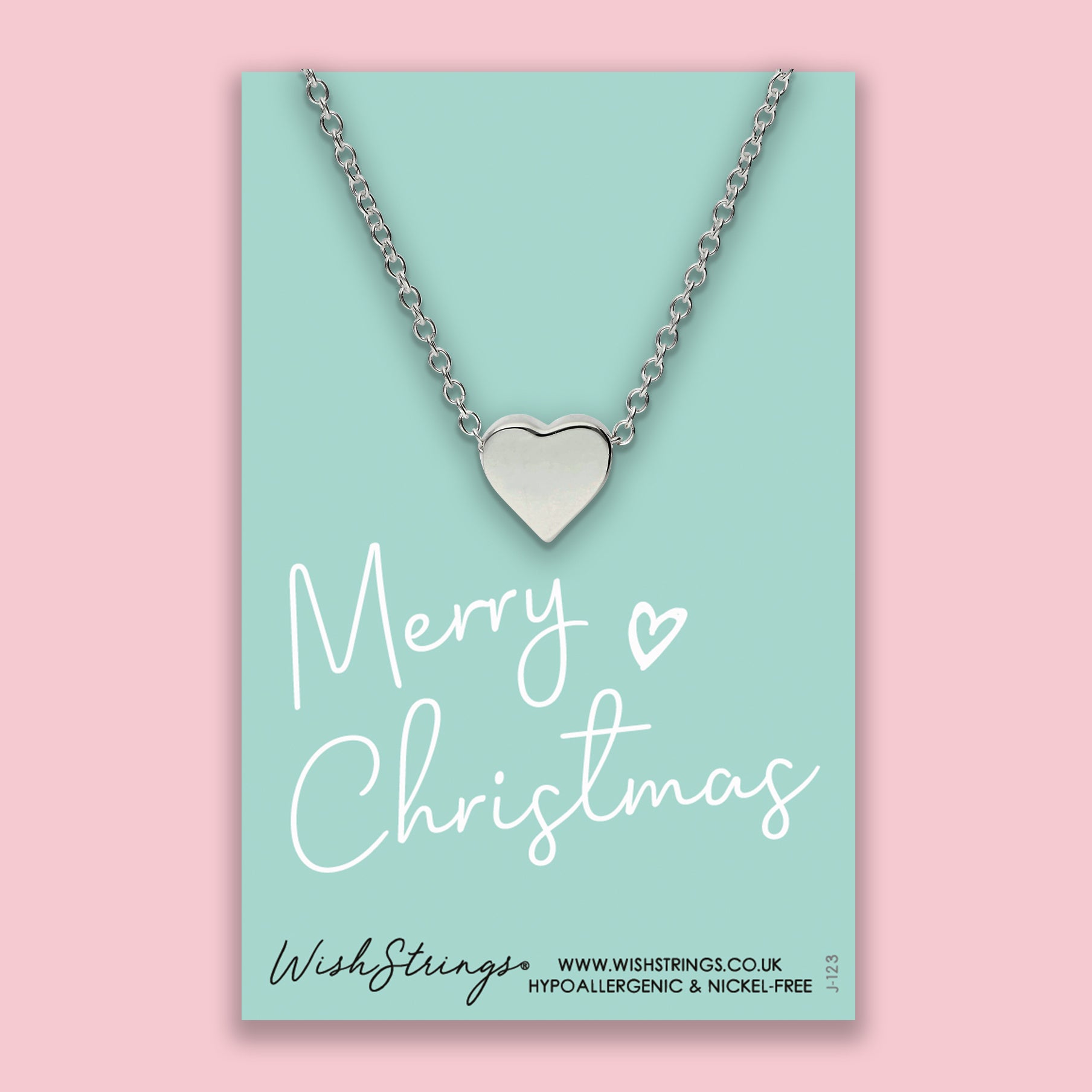 Merry Christmas Heart Necklace, handmade in the UK, featuring a heart-shaped pendant on a delicate chain, perfect for festive gifting.