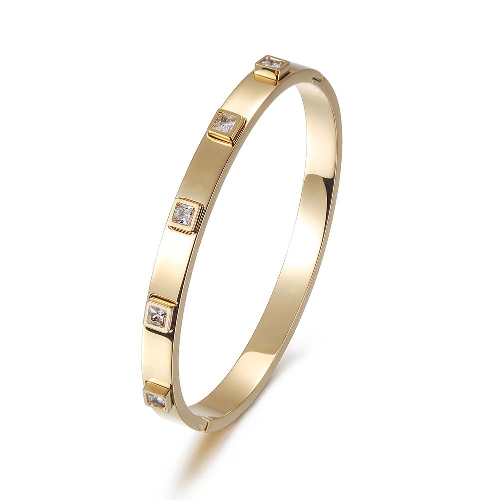 A stylish Metal Stone Hinged Bangle made of 316L surgical stainless steel with 14K gold PVD plating, showcasing its elegant design.