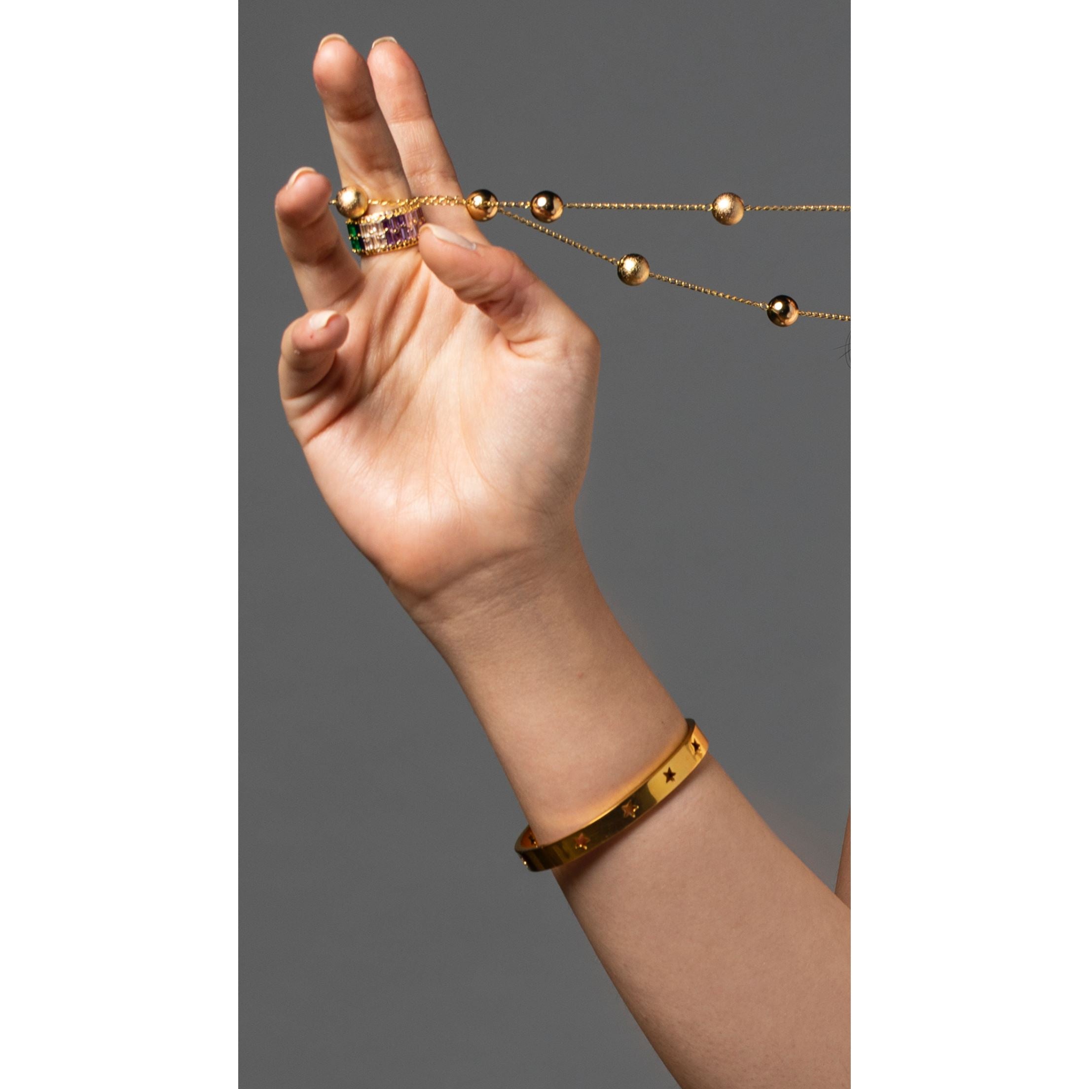 Mia Star Bracelet featuring perforated stars, 18k gold plated over stainless steel, perfect for layering.