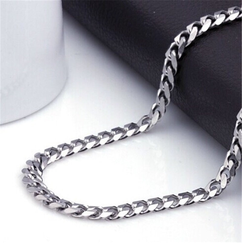 A stylish Miami Cuban chain necklace made of titanium steel, showcasing its shiny finish and available in various widths.