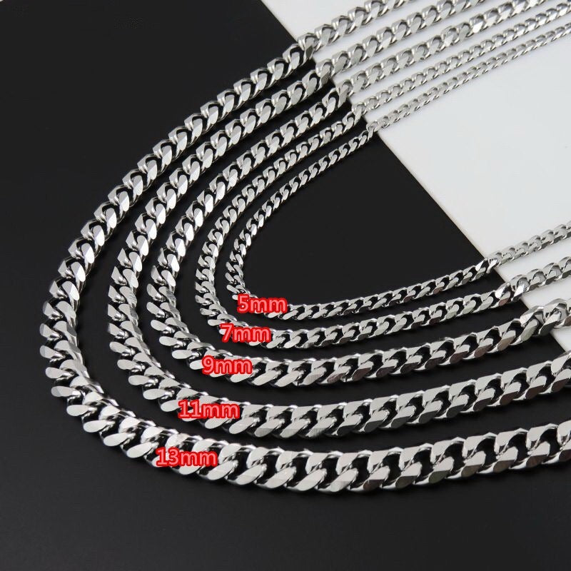 A stylish Miami Cuban chain necklace made of titanium steel, showcasing its shiny finish and available in various widths.