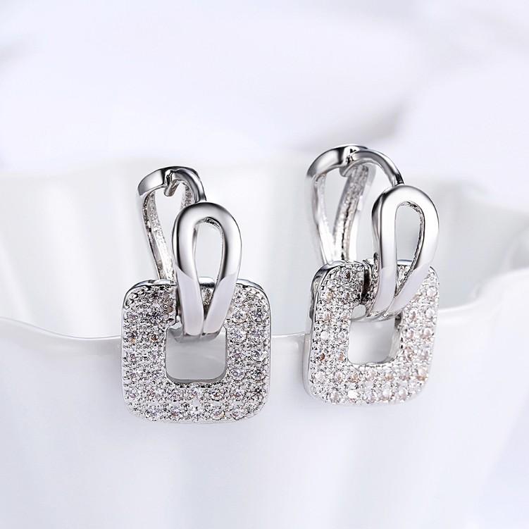 Micro-Pav'e Austrian Crystal Square Shaped Earrings set in 18K White gold plating, showcasing their elegant design and sparkling crystals.