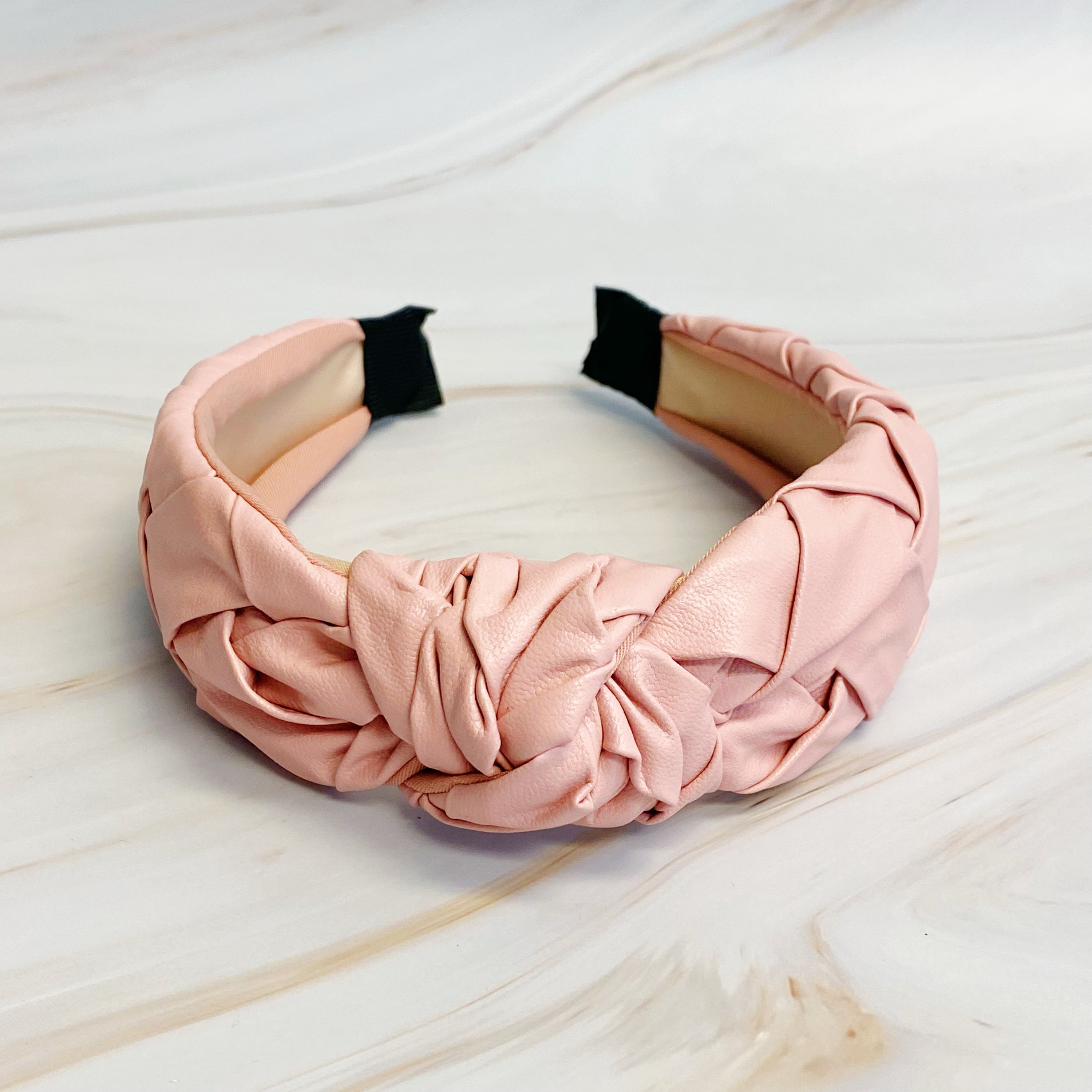 Milano Woven And Knotted Headband featuring a stylish leather woven design and intricate knotted detail.