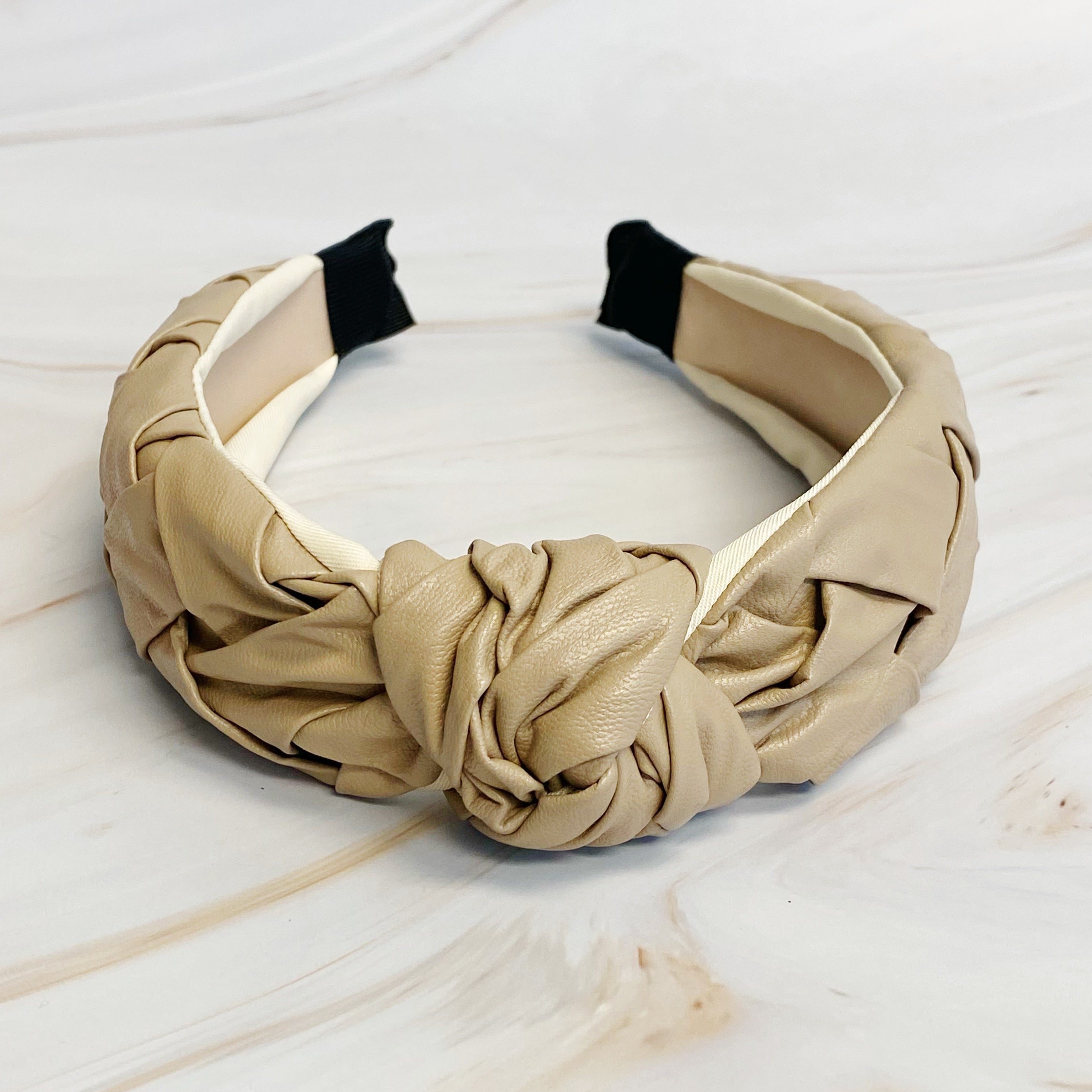 Milano Woven And Knotted Headband featuring a stylish leather woven design and intricate knotted detail.