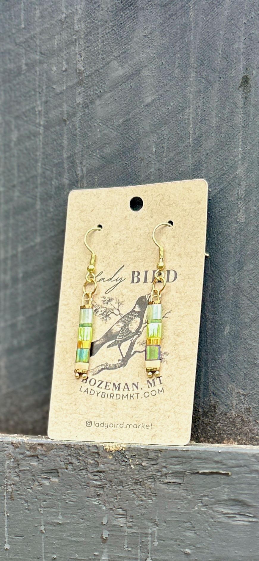 Mild Meadow Mixed Green & Gold Tila Bead Earrings featuring vibrant green beads with creamy white and gold accents, showcasing a bohemian style.