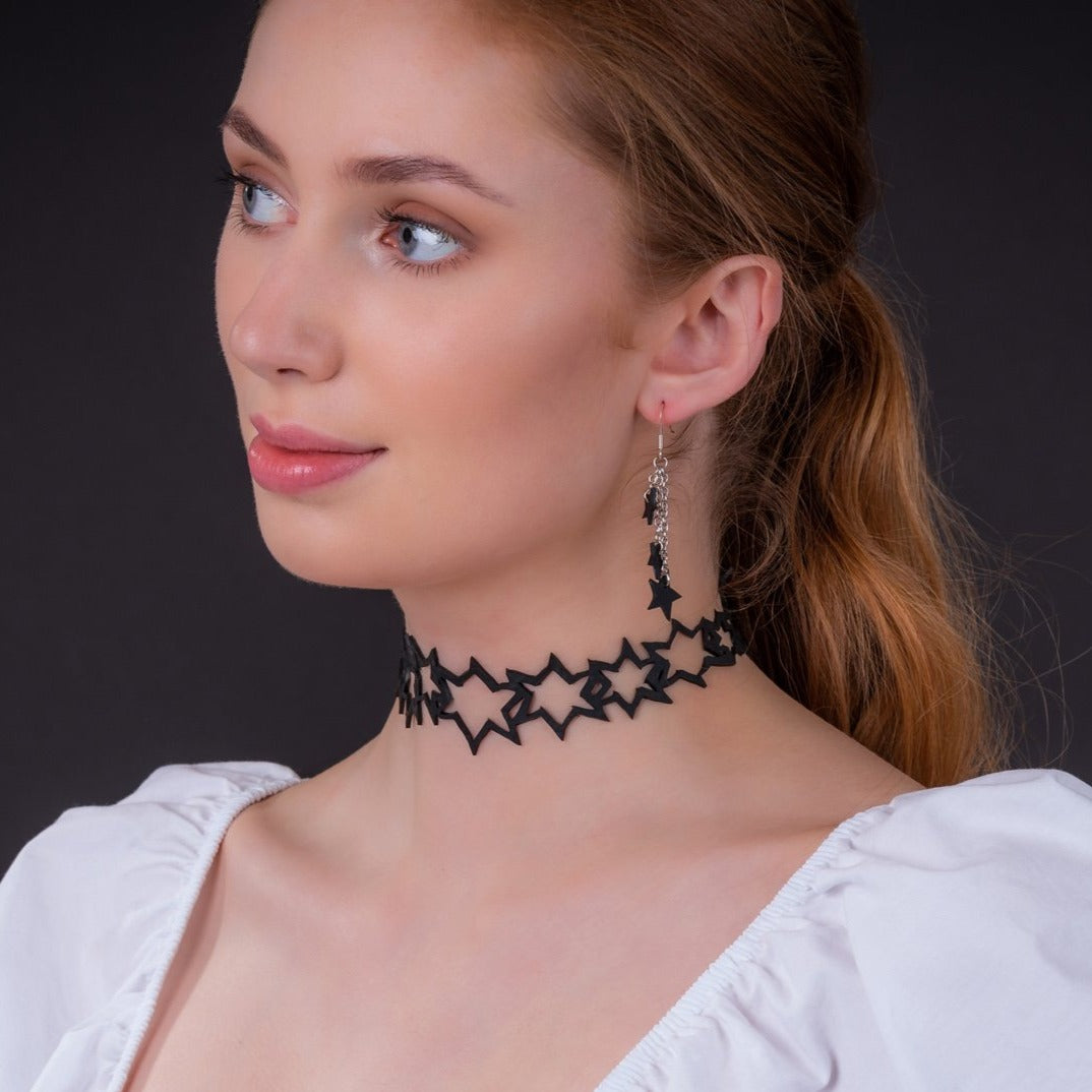 Milky Way Inner Tube Star Choker made from recycled rubber, featuring a unique design with adjustable buttons and a luxurious gift box.