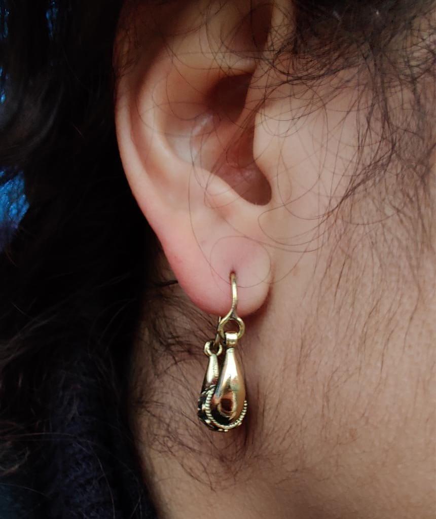 A pair of Mini Boho Hoop Earrings featuring a massive ethnic design, handmade in England with silver plated hypoallergenic brass.