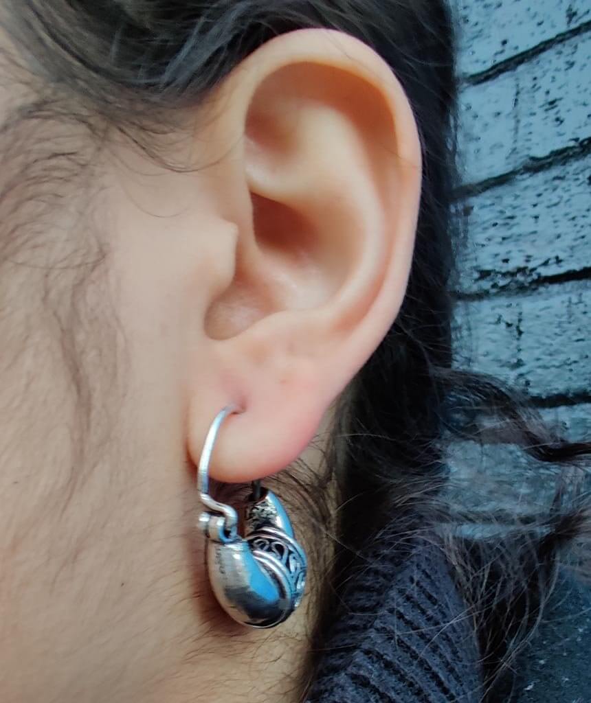 A pair of Mini Boho Hoop Earrings featuring a massive ethnic design, handmade in England with silver plated hypoallergenic brass.