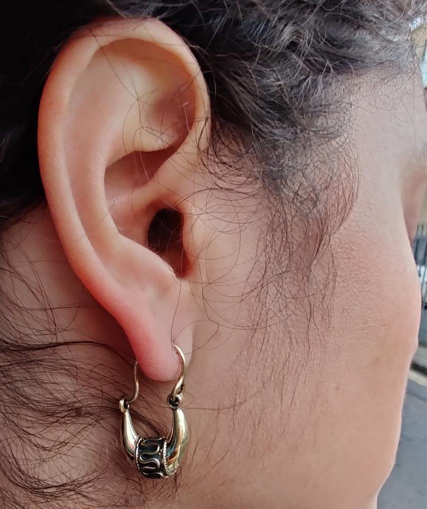 A pair of Mini Boho Hoop Earrings featuring a massive ethnic design, handmade in England with silver plated hypoallergenic brass.