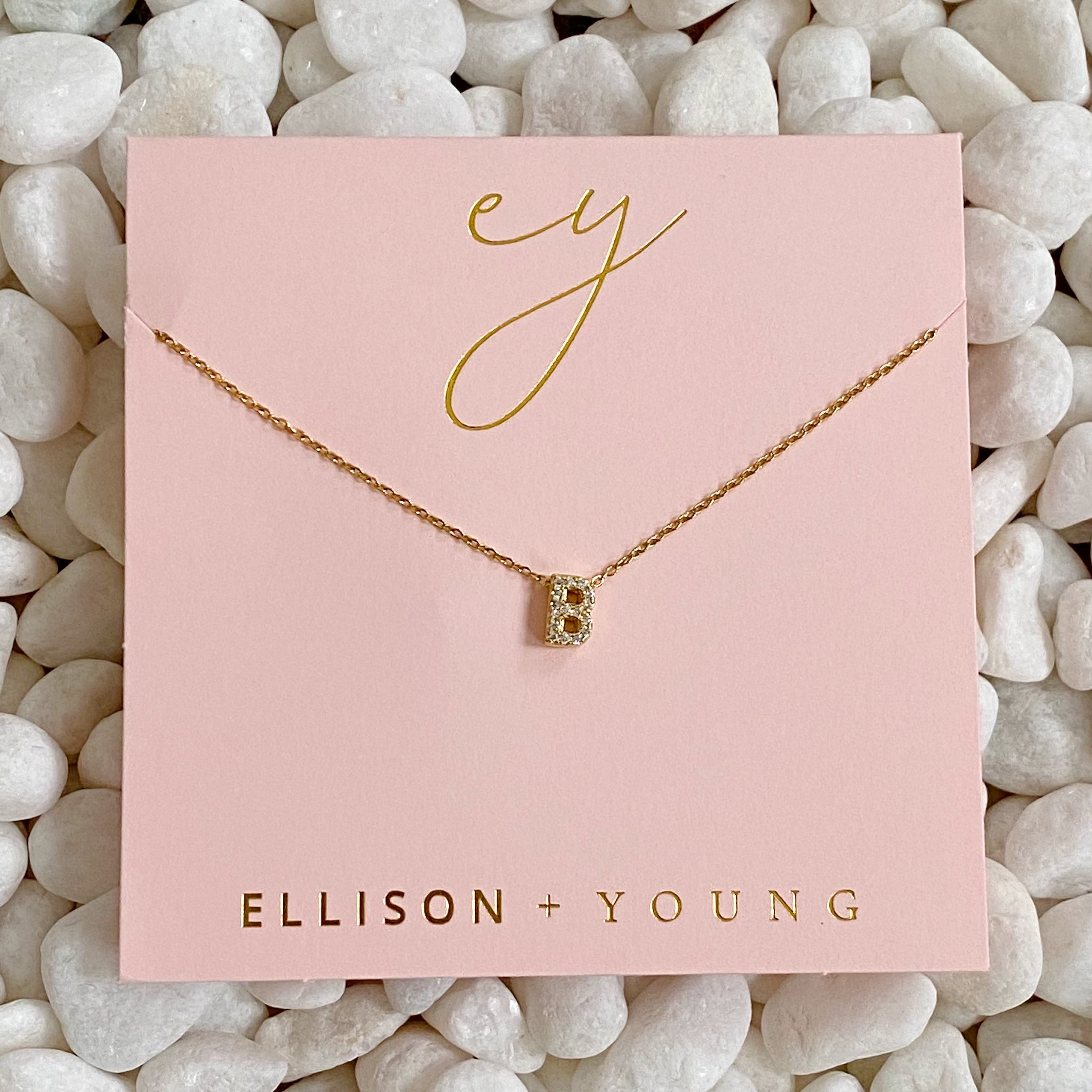 Mini Keepsake Initial Necklace featuring a small initial pendant on a dainty gold plated chain with cubic zirconia accents.