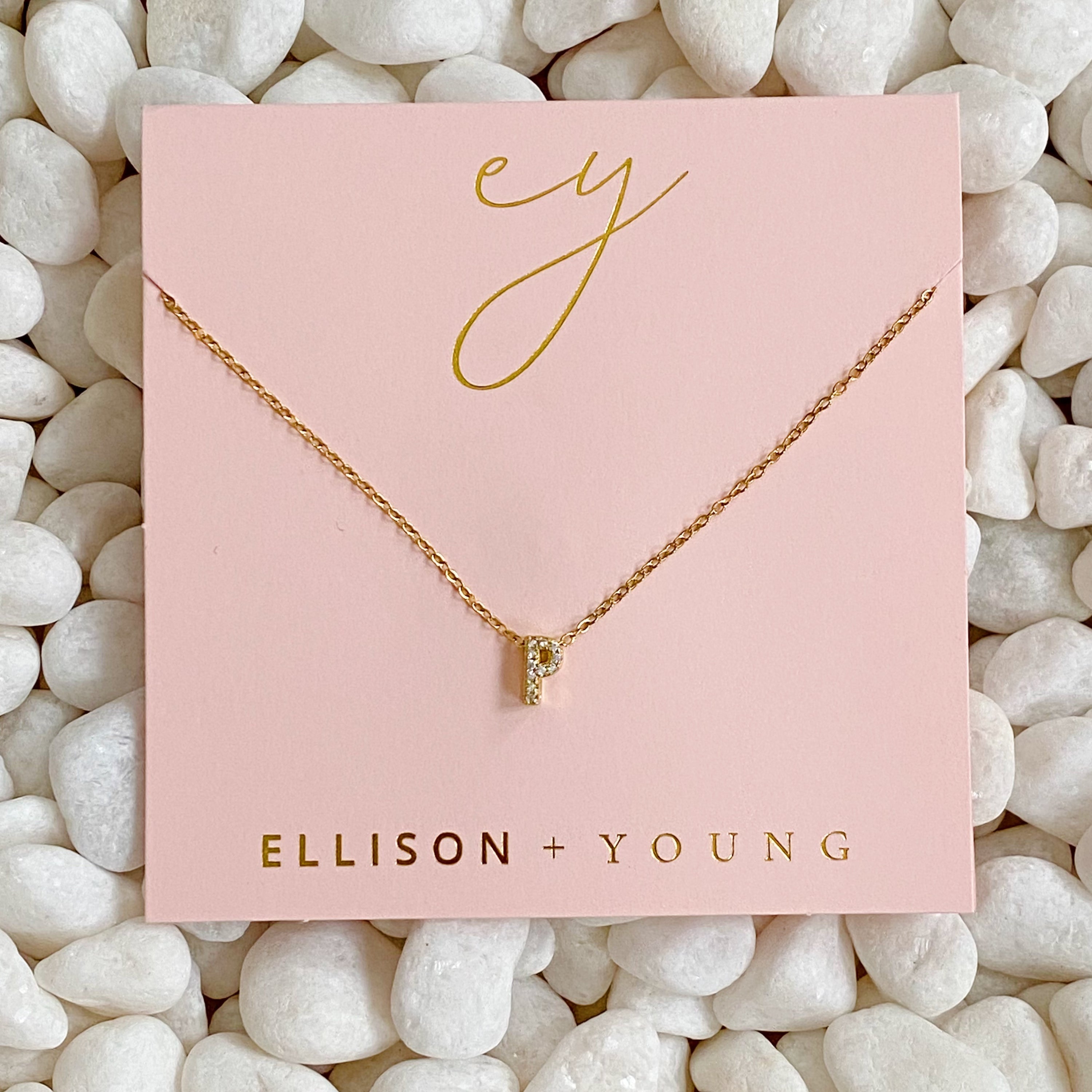 Mini Keepsake Initial Necklace featuring a small initial pendant on a dainty gold plated chain with cubic zirconia accents.