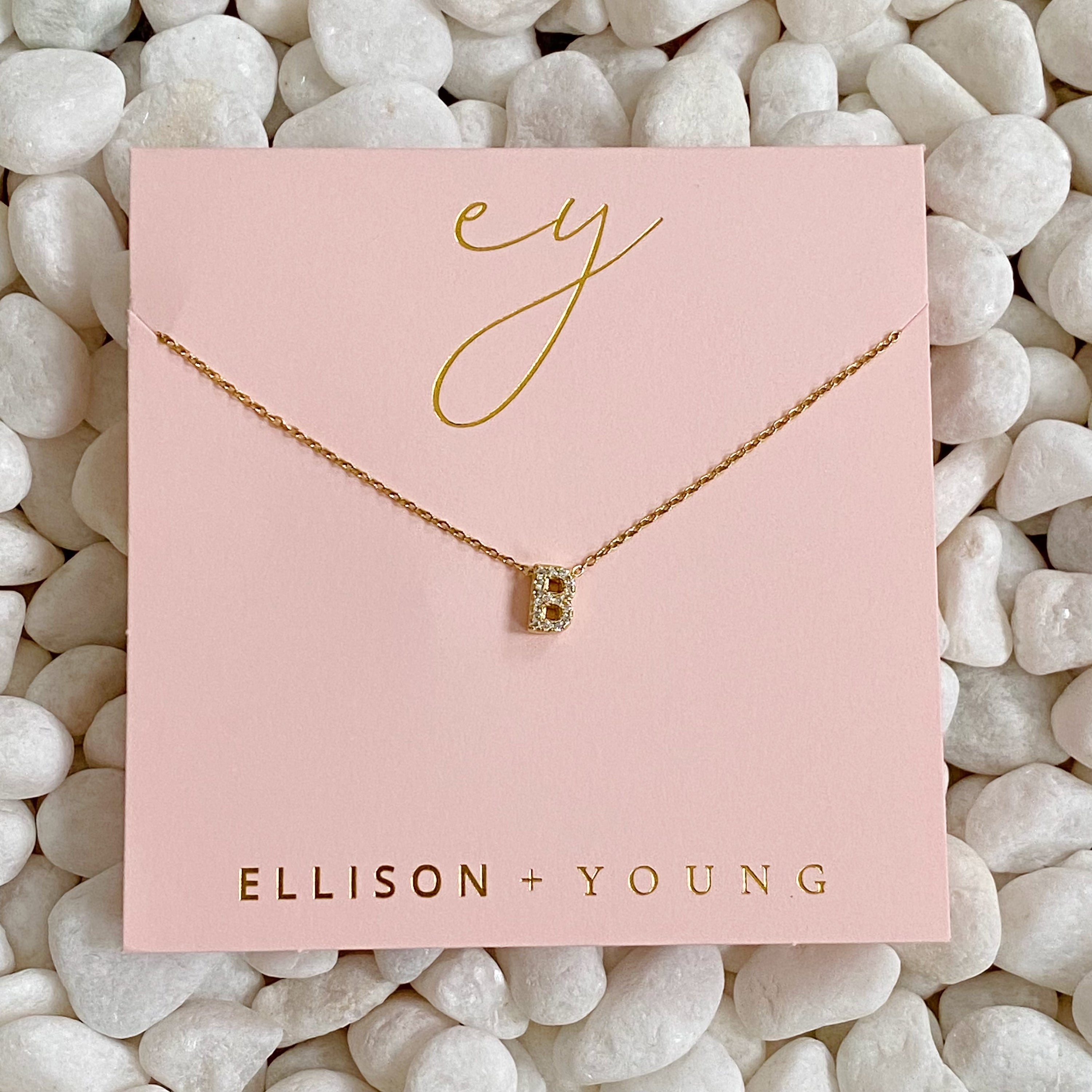 Mini Keepsake Initial Necklace featuring a small initial pendant on a dainty gold plated chain with cubic zirconia accents.