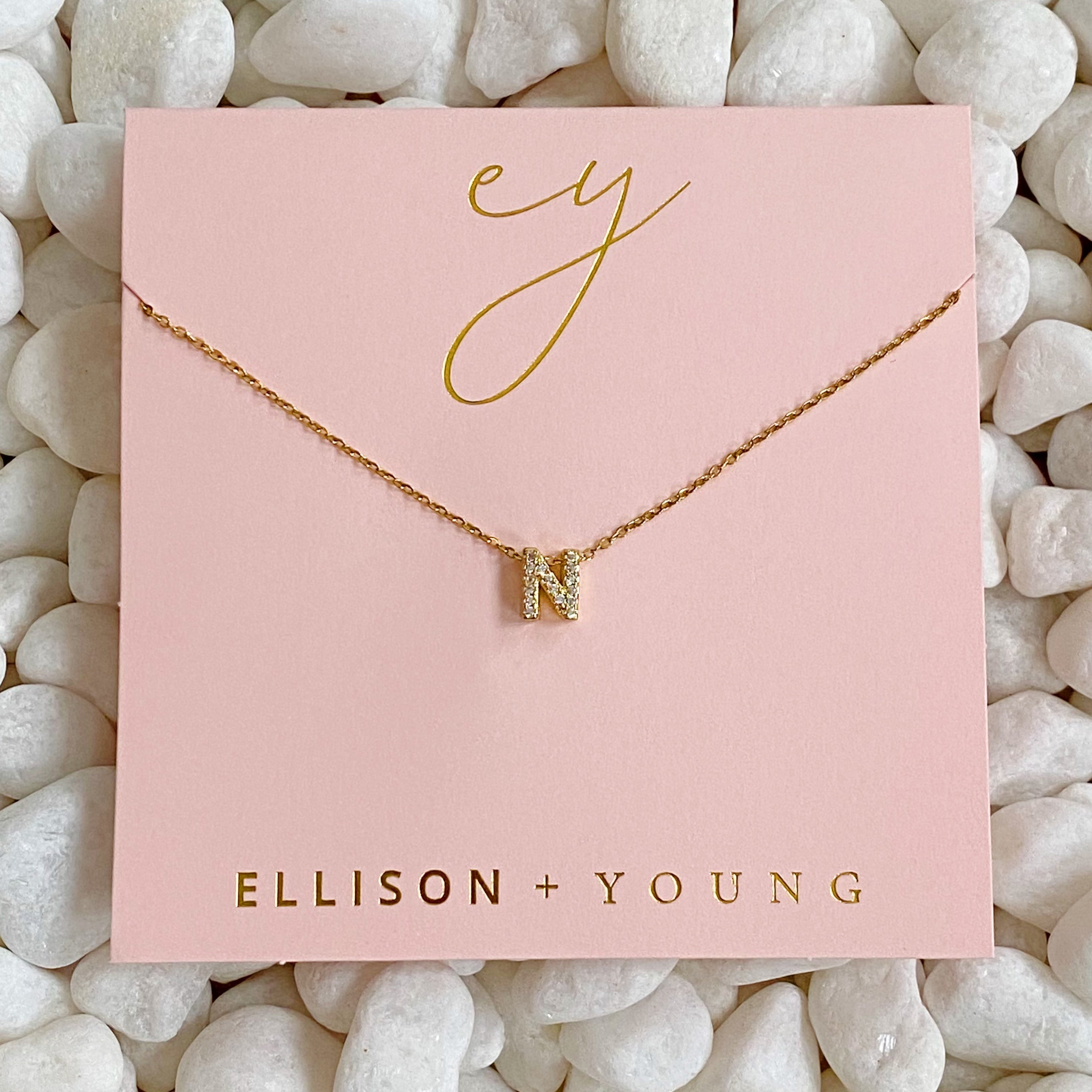 Mini Keepsake Initial Necklace featuring a small initial pendant on a dainty gold plated chain with cubic zirconia accents.