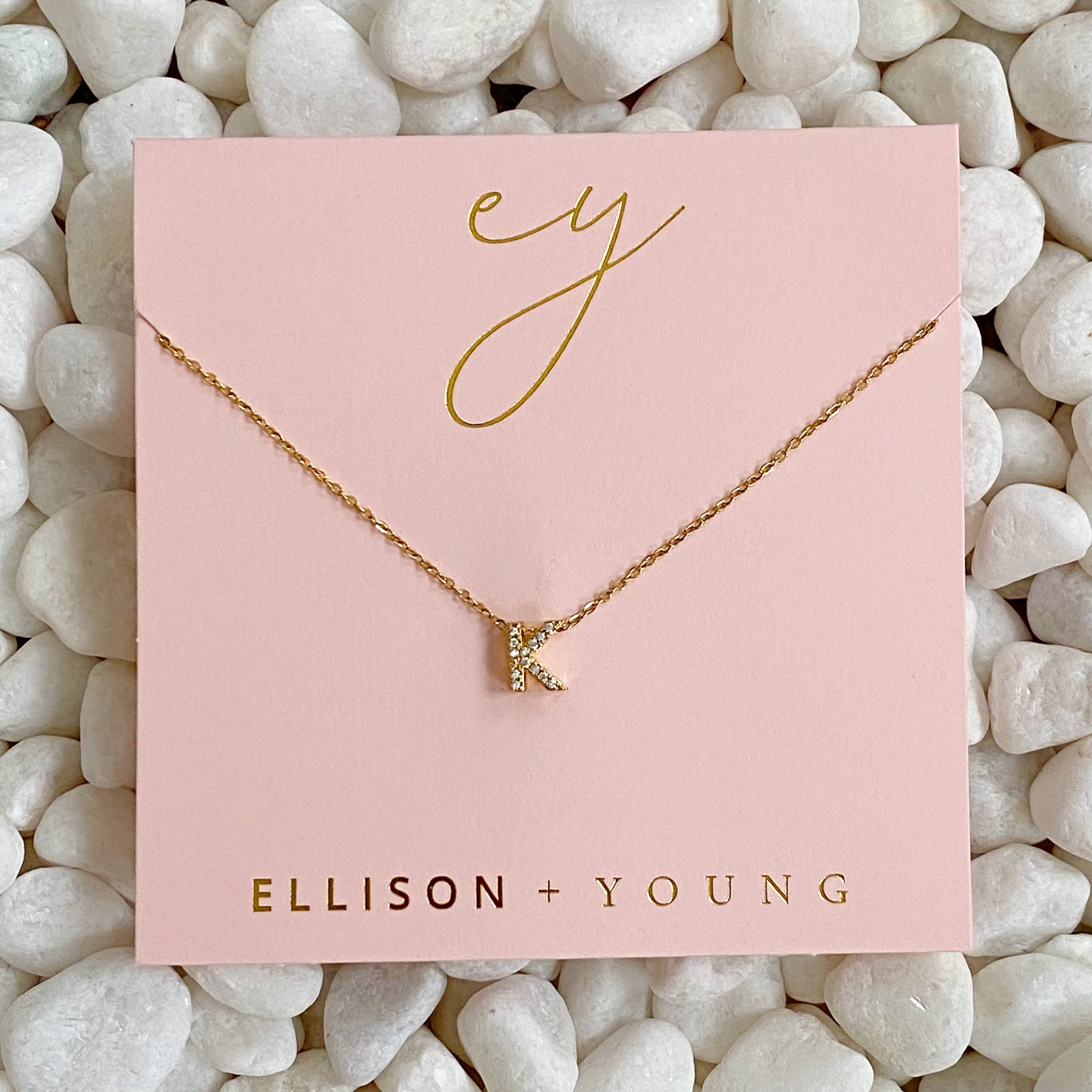 Mini Keepsake Initial Necklace featuring a small initial pendant on a dainty gold plated chain with cubic zirconia accents.