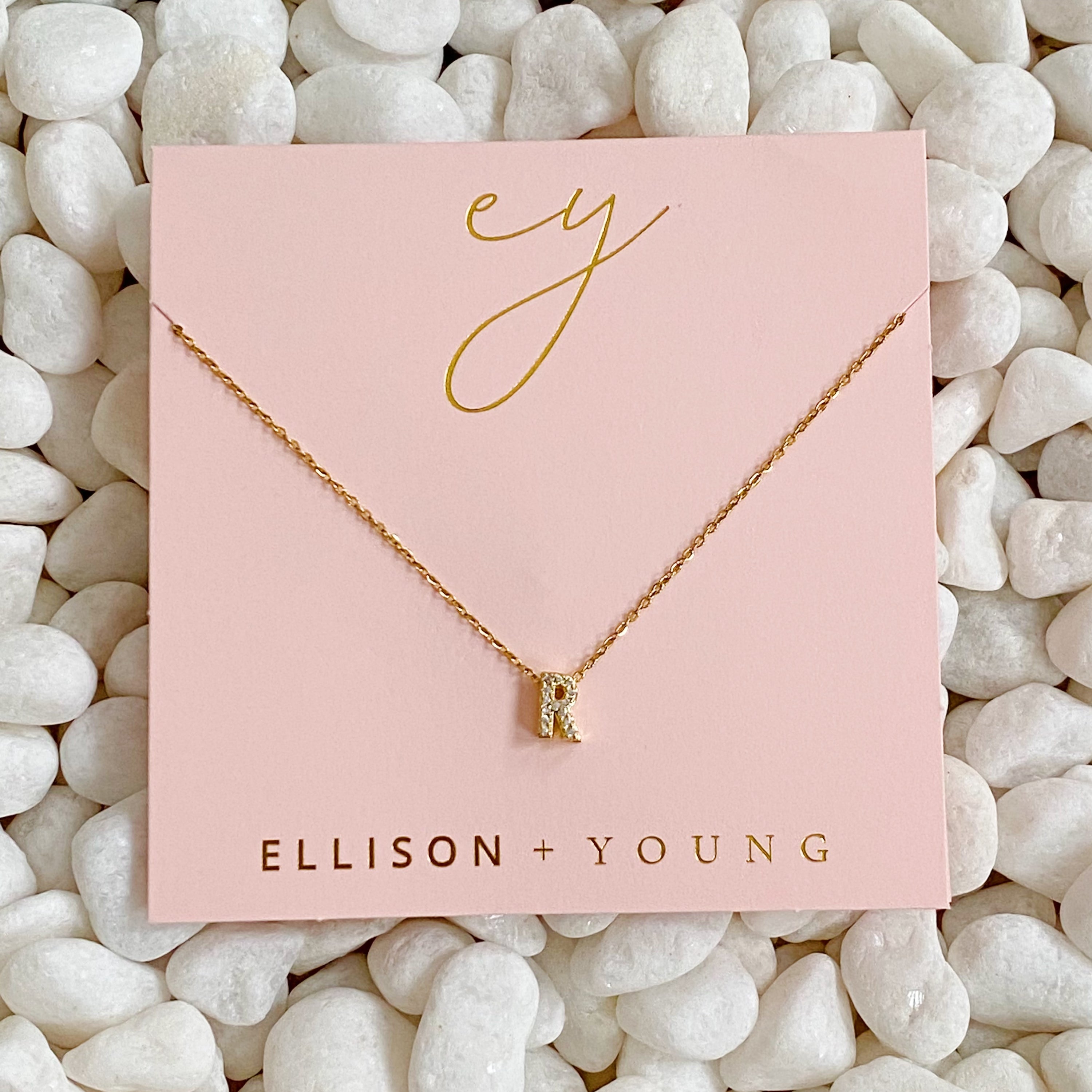 Mini Keepsake Initial Necklace featuring a small initial pendant on a dainty gold plated chain with cubic zirconia accents.