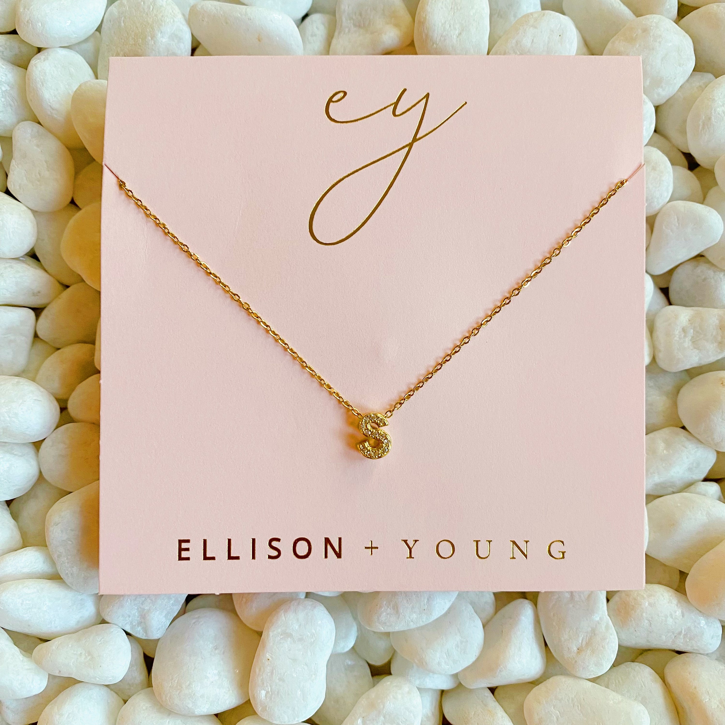 Mini Keepsake Initial Necklace featuring a small initial pendant on a dainty gold plated chain with cubic zirconia accents.