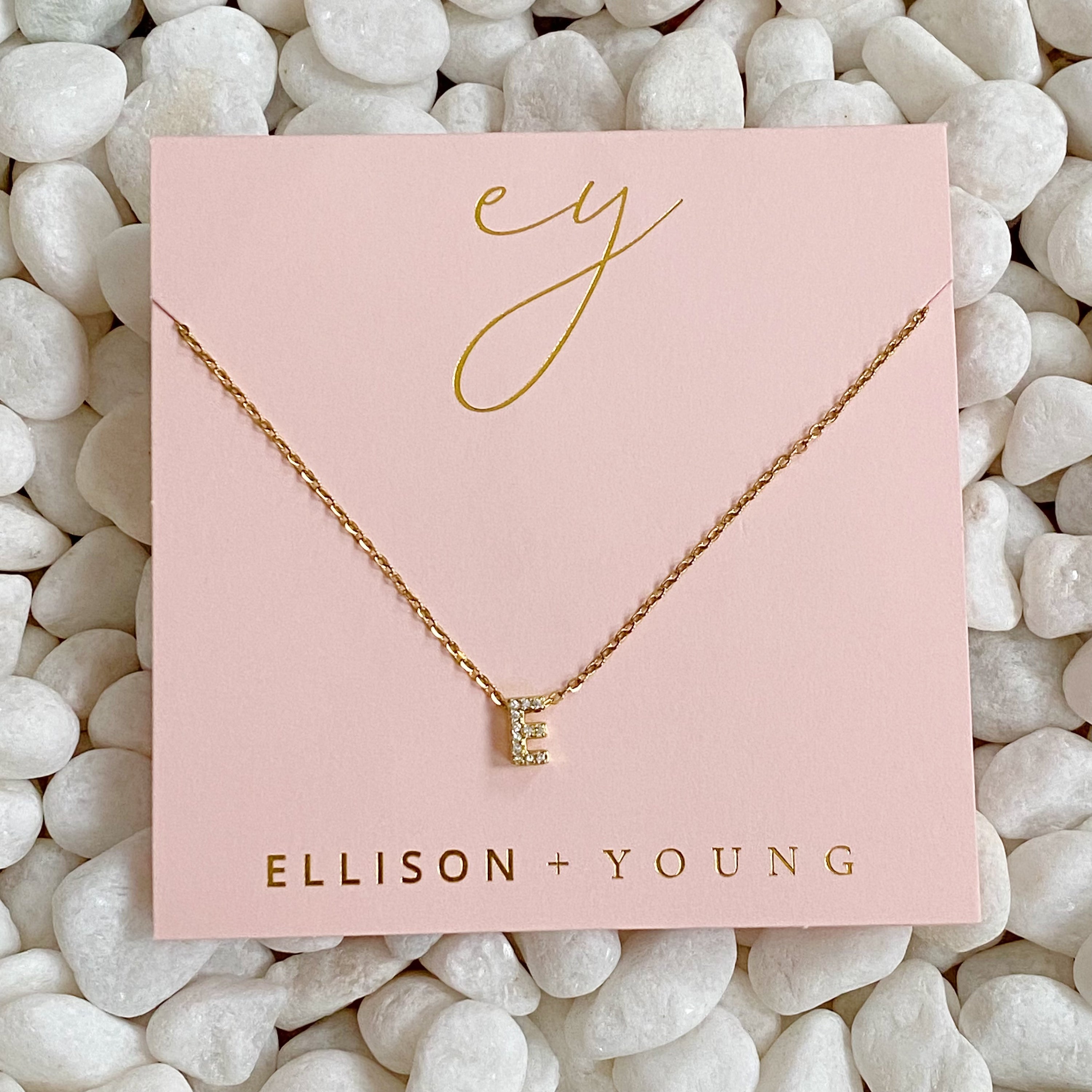 Mini Keepsake Initial Necklace featuring a small initial pendant on a dainty gold plated chain with cubic zirconia accents.