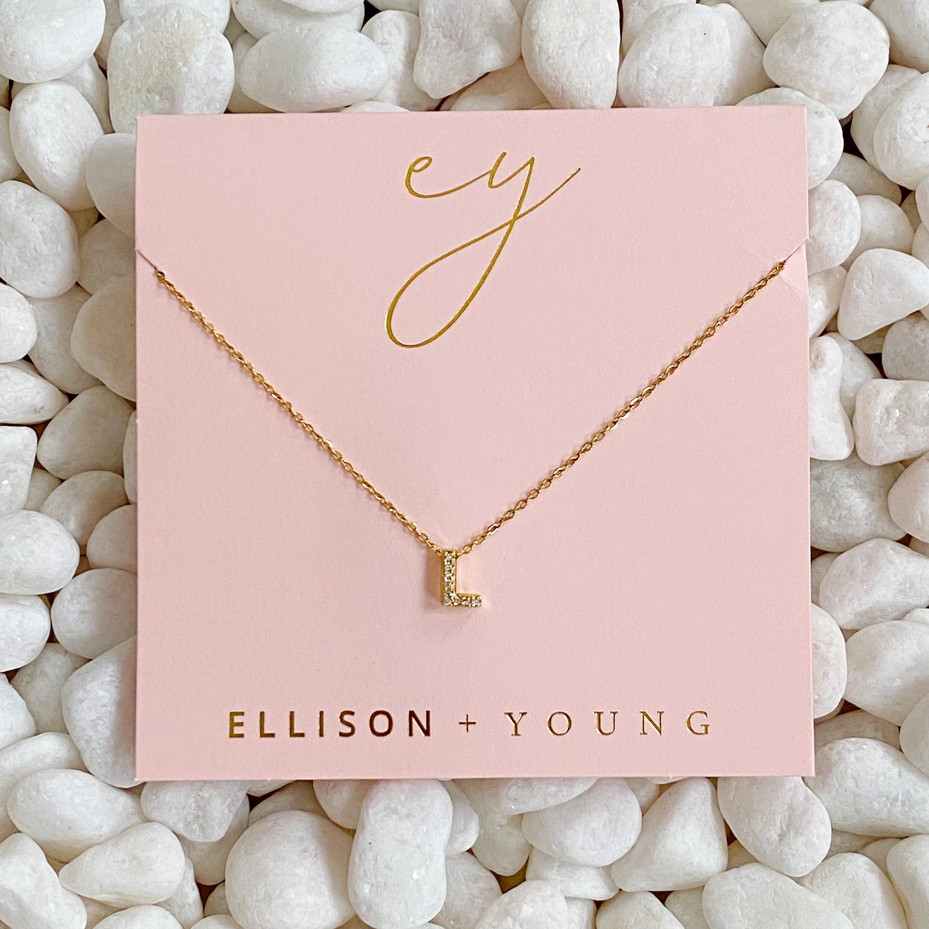 Mini Keepsake Initial Necklace featuring a small initial pendant on a dainty gold plated chain with cubic zirconia accents.