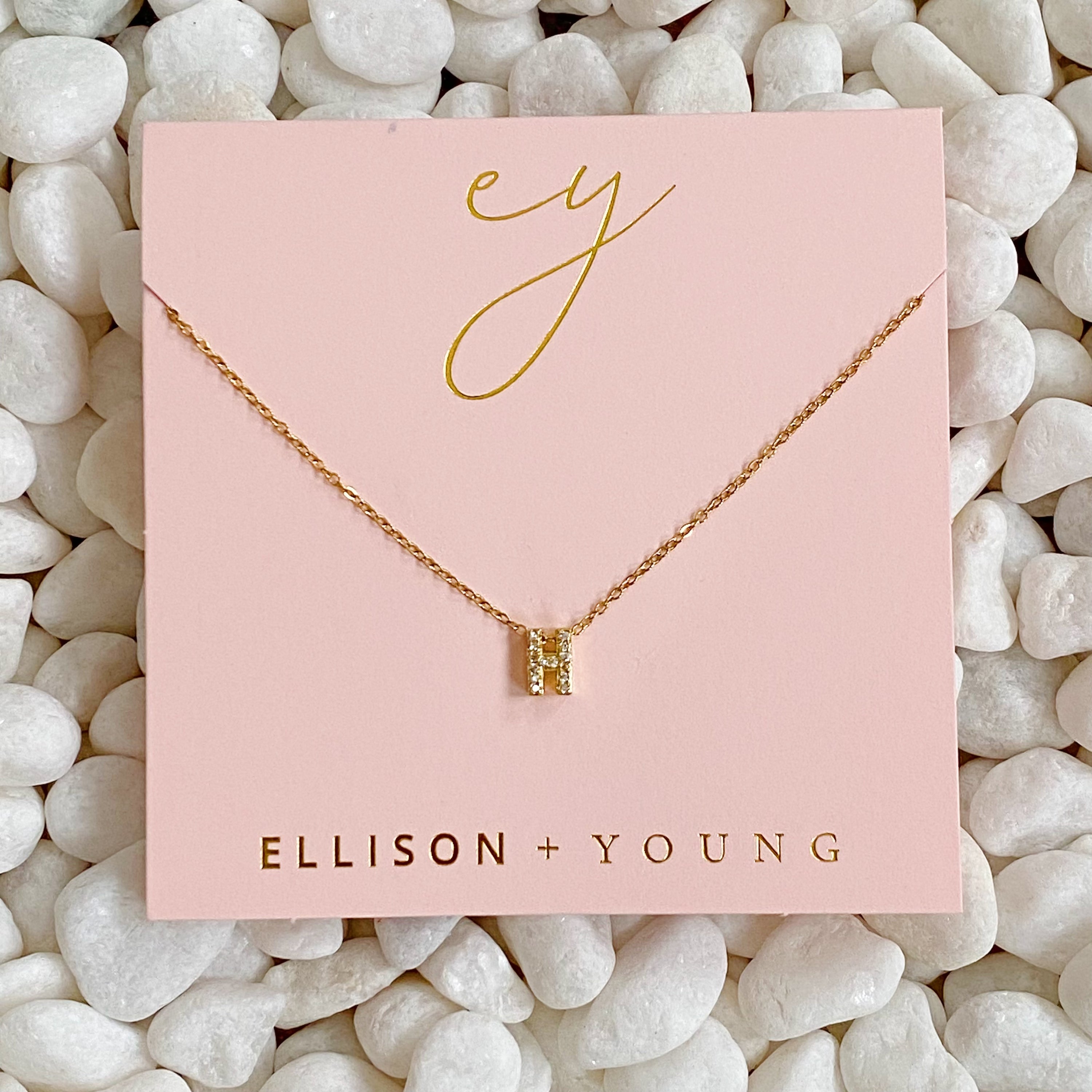 Mini Keepsake Initial Necklace featuring a small initial pendant on a dainty gold plated chain with cubic zirconia accents.