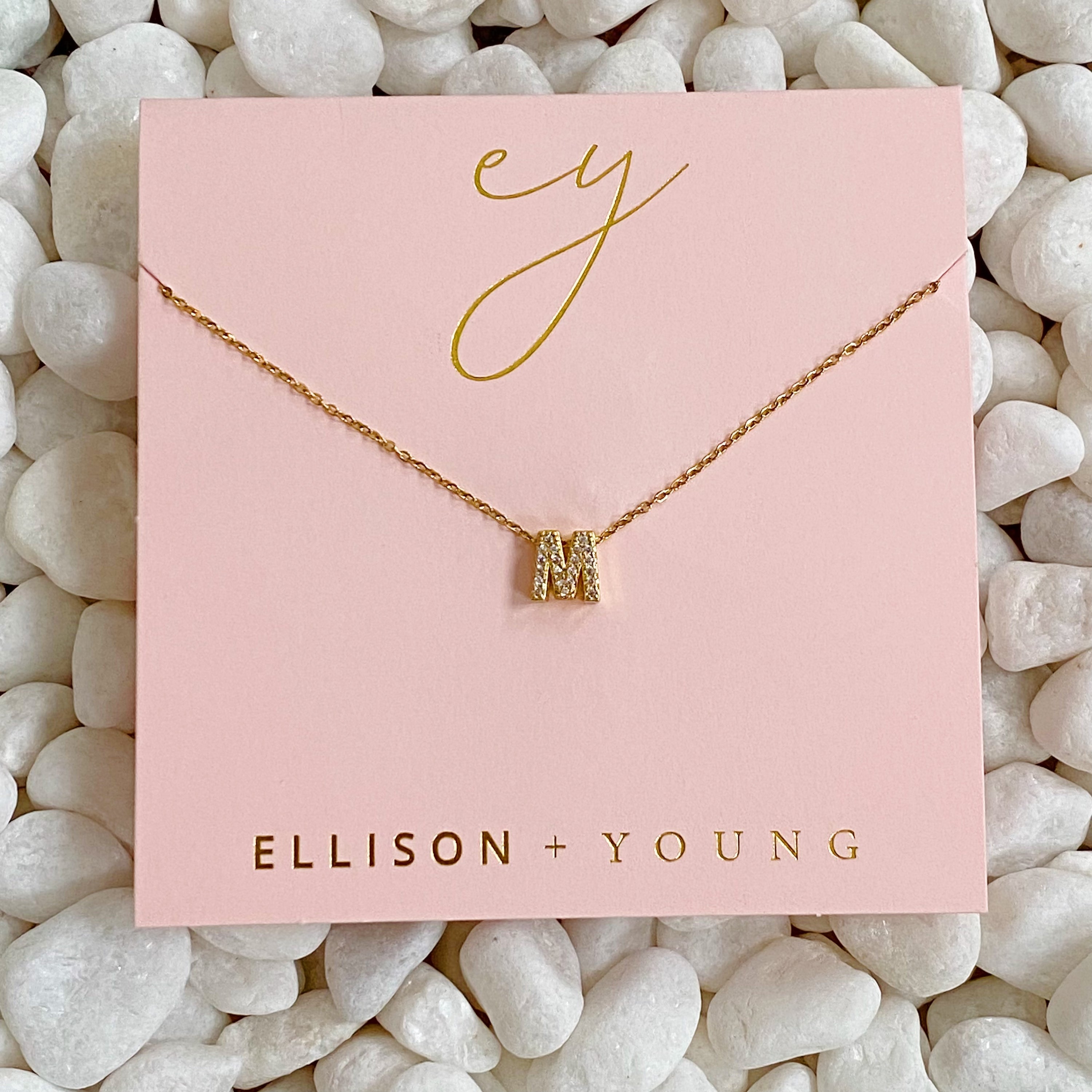 Mini Keepsake Initial Necklace featuring a small initial pendant on a dainty gold plated chain with cubic zirconia accents.