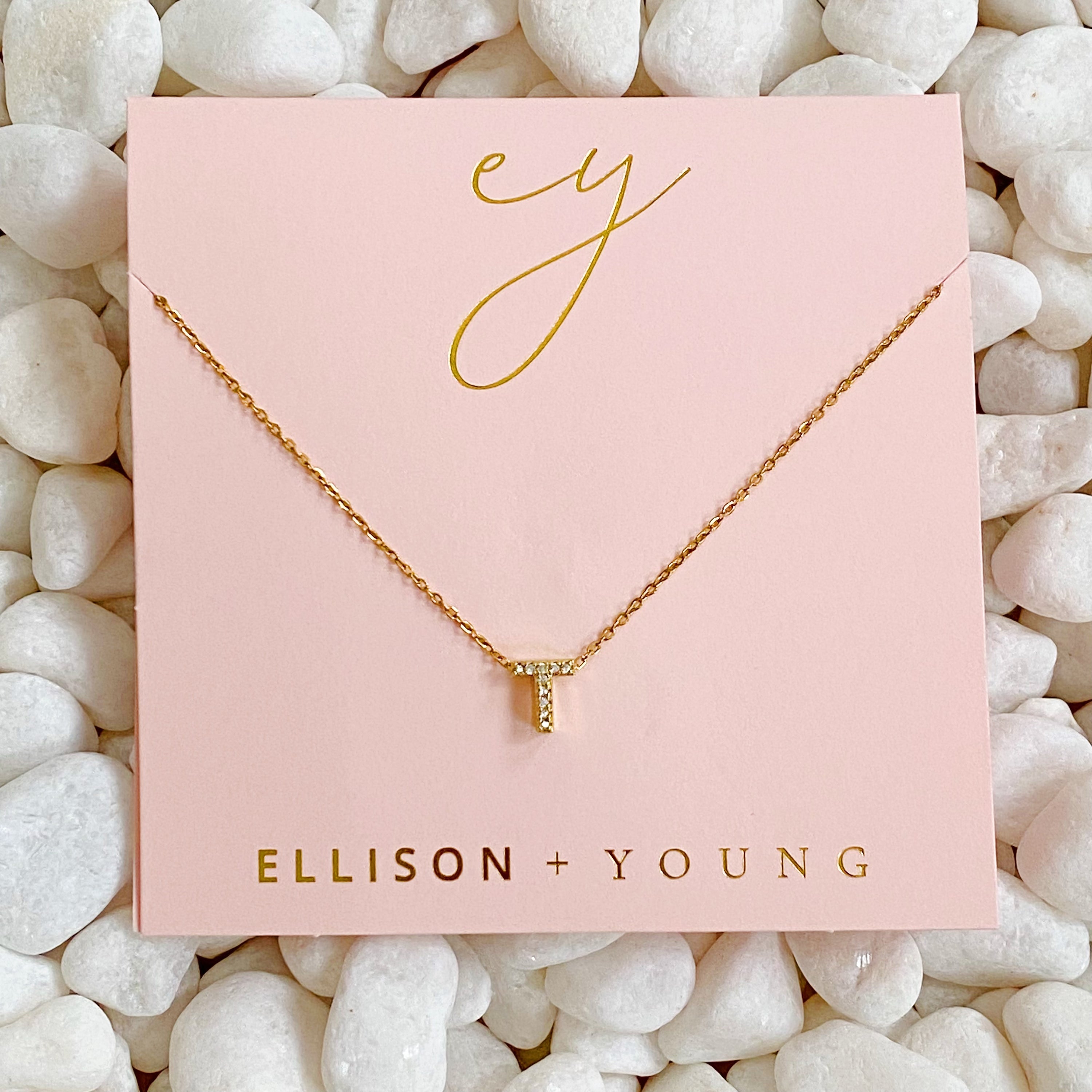 Mini Keepsake Initial Necklace featuring a small initial pendant on a dainty gold plated chain with cubic zirconia accents.