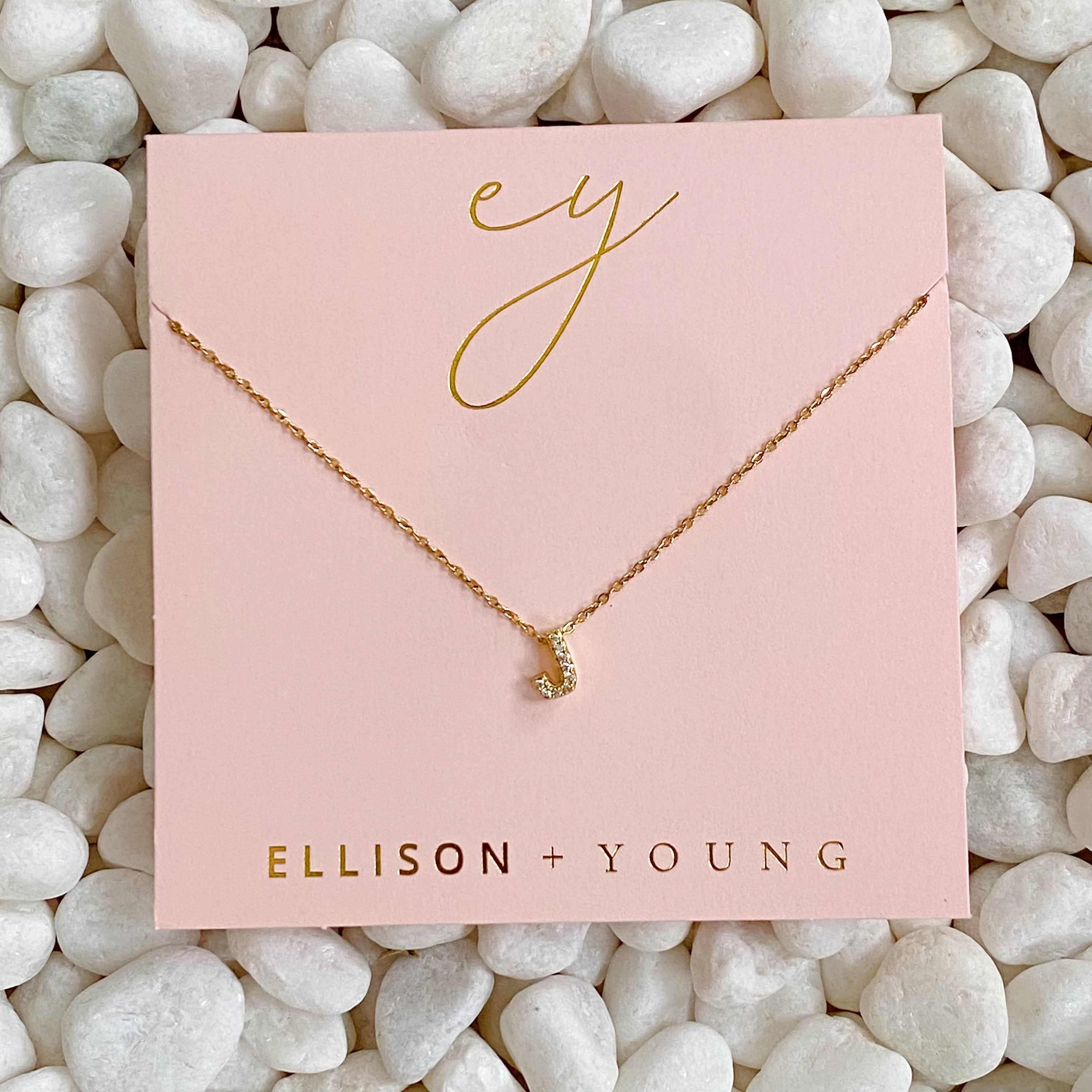 Mini Keepsake Initial Necklace featuring a small initial pendant on a dainty gold plated chain with cubic zirconia accents.