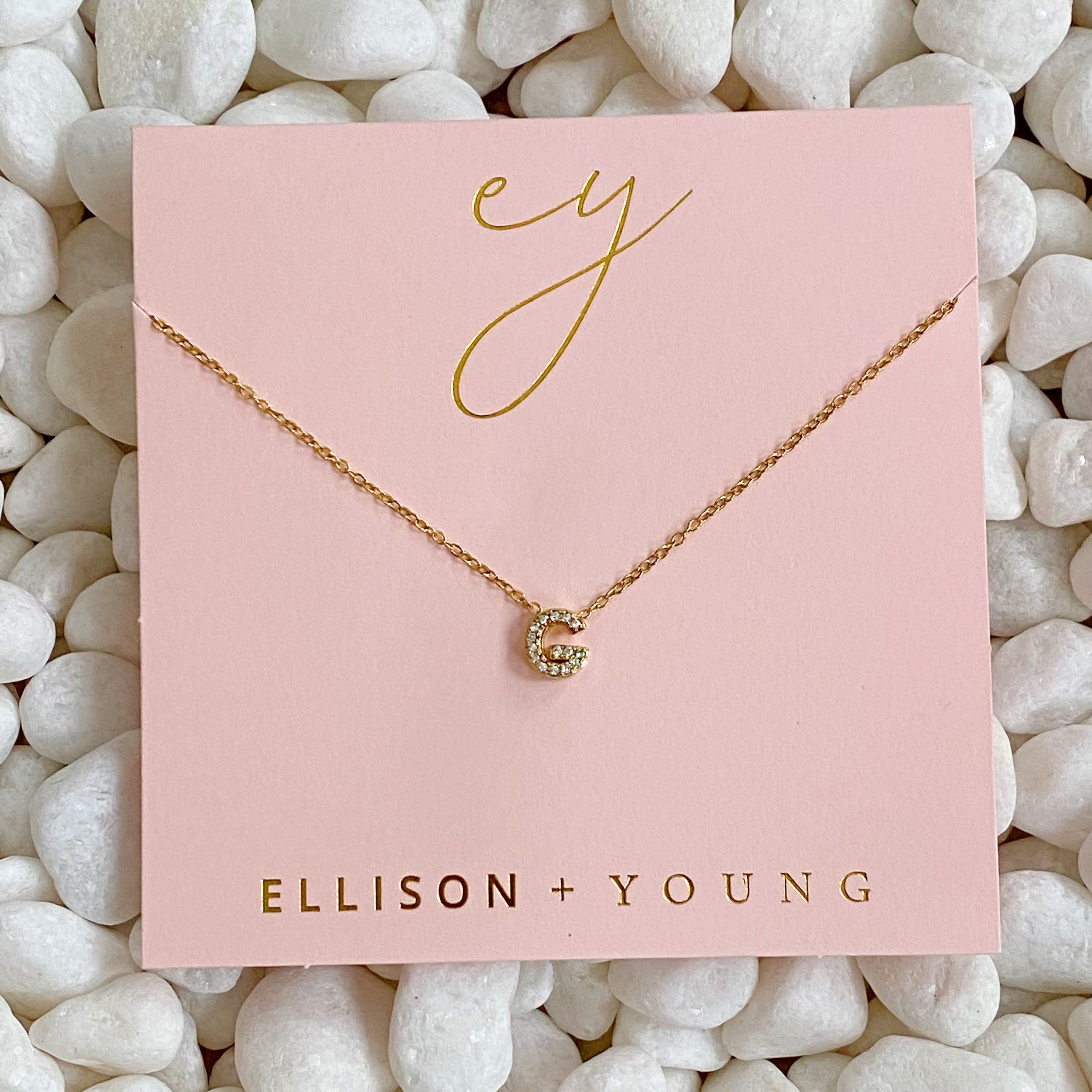 Mini Keepsake Initial Necklace featuring a small initial pendant on a dainty gold plated chain with cubic zirconia accents.