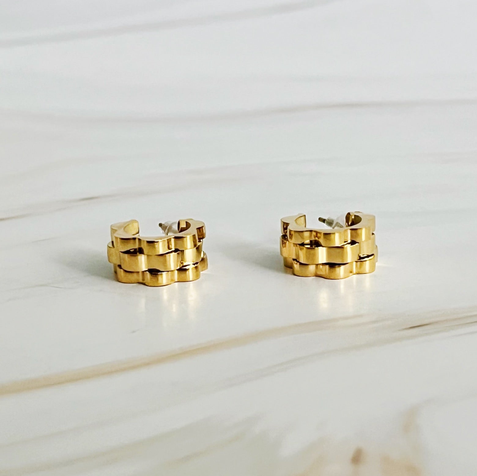 Mini Luxe Hoop Earrings featuring a unique shape design in 18k gold plated stainless steel, elegantly crafted for versatile wear.