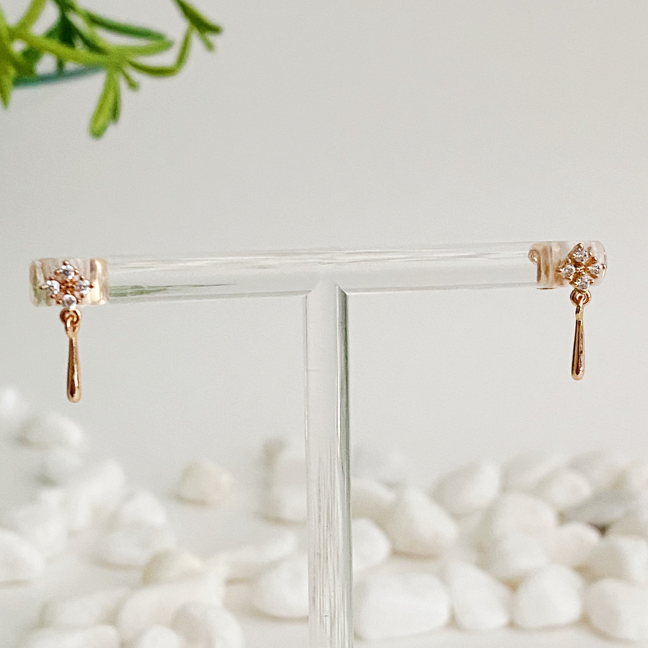 Mini Twinkle Dangle Earrings featuring delicate teardrop design with cubic zirconia sparkles, elegantly crafted in gold plated brass.