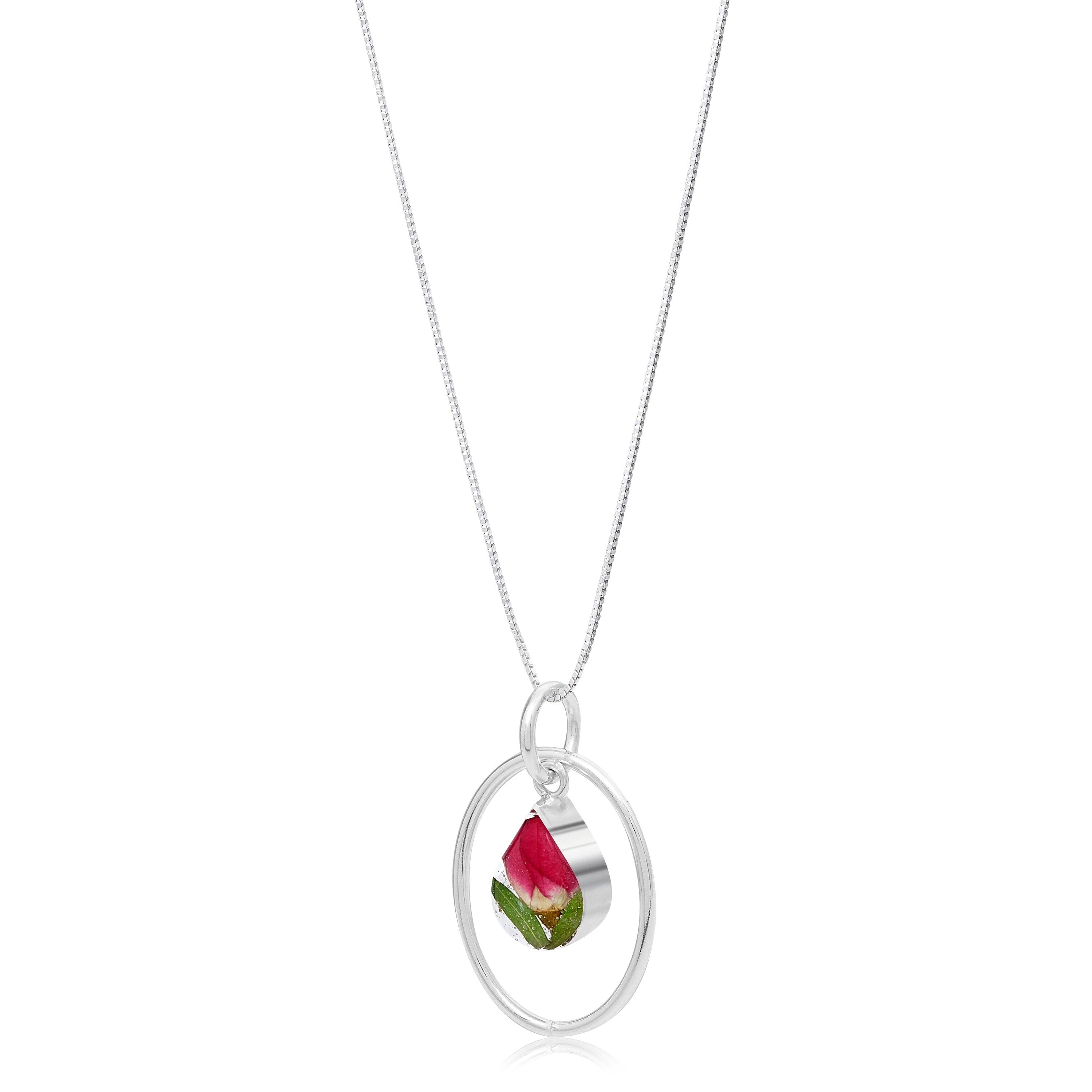 Miniature rose necklace featuring a sterling silver teardrop pendant with real flowers, elegantly handcrafted by Shrieking Violet.