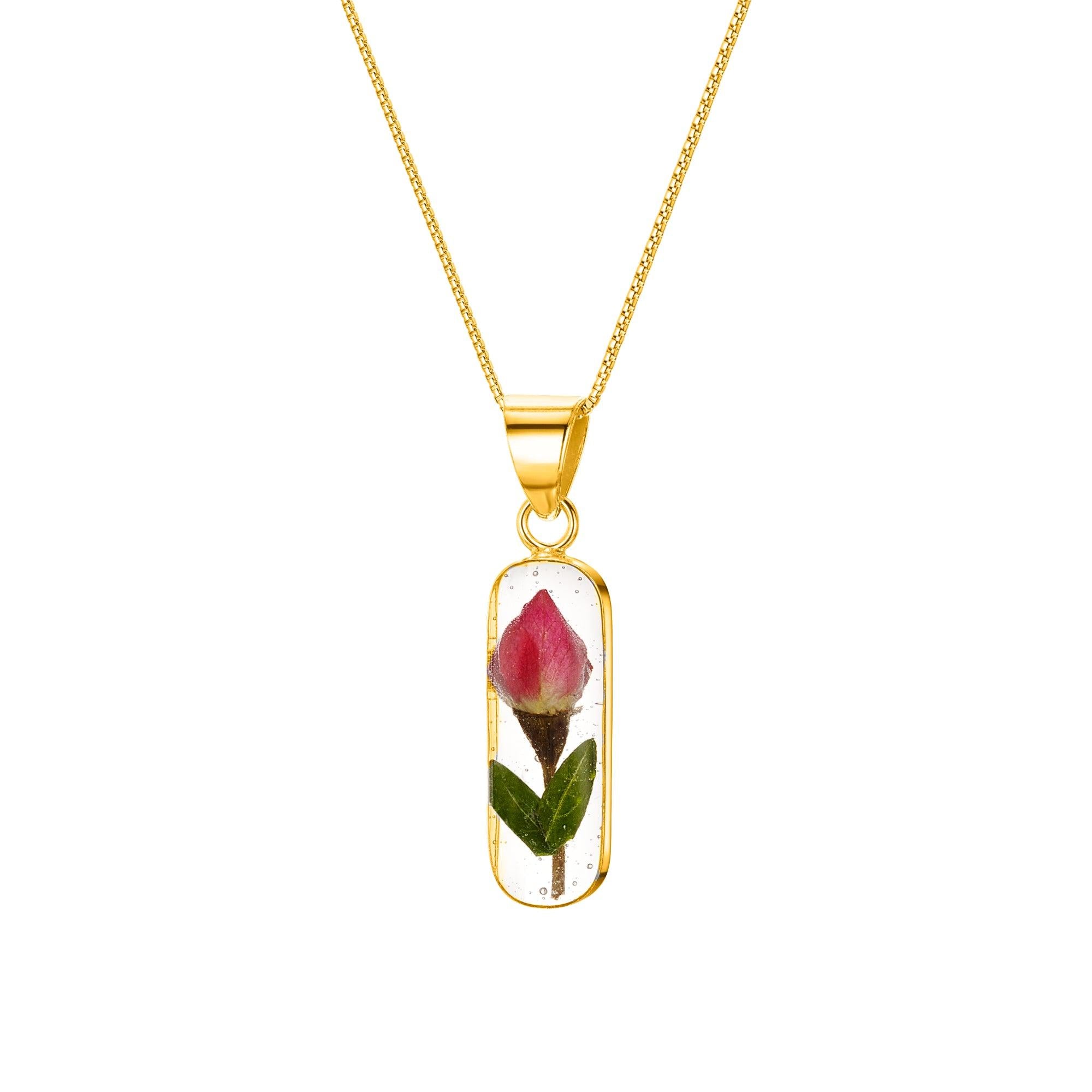 Miniature Rose necklace 'Leela' featuring a vertical bar pendant with a preserved rose bud, handmade in sterling silver.