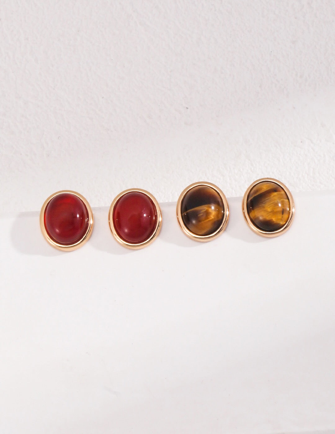 Minimalist Tiger Eye and Onyx Stud Earrings with gold vermeil setting, showcasing natural stones and elegant design.