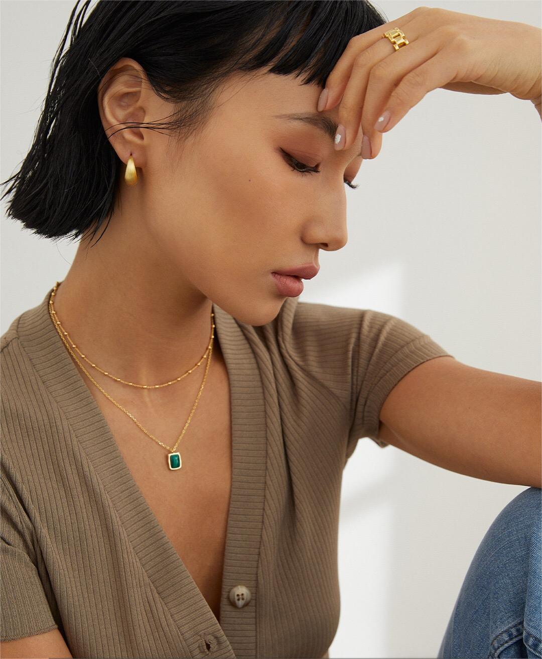 A delicate Minimalist Ball Chain Necklace featuring gold vermeil and silver beads, elegantly displayed on a soft background.